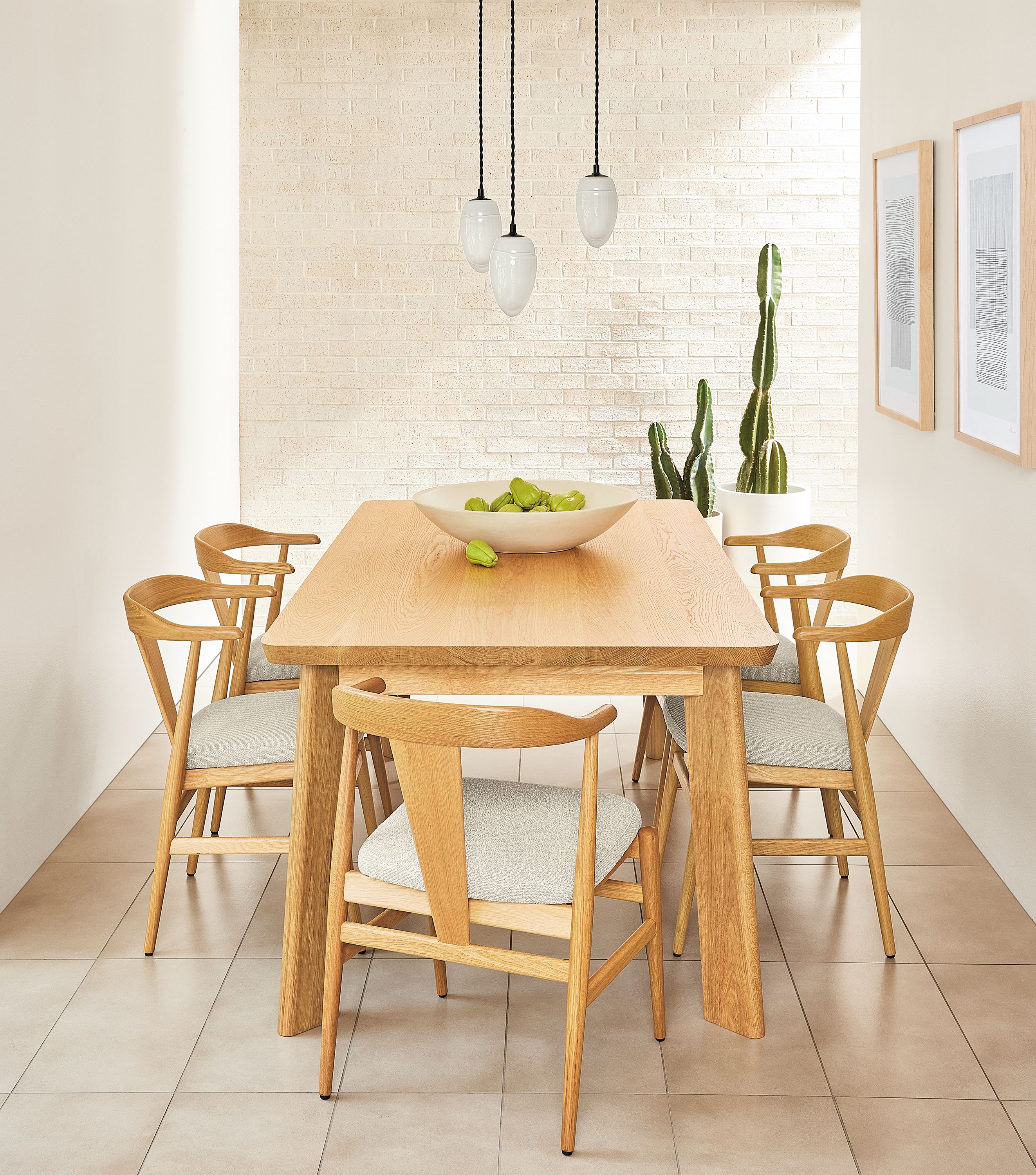 Minimalist dining room with Colby table, Evan chairs and Polar pendants.