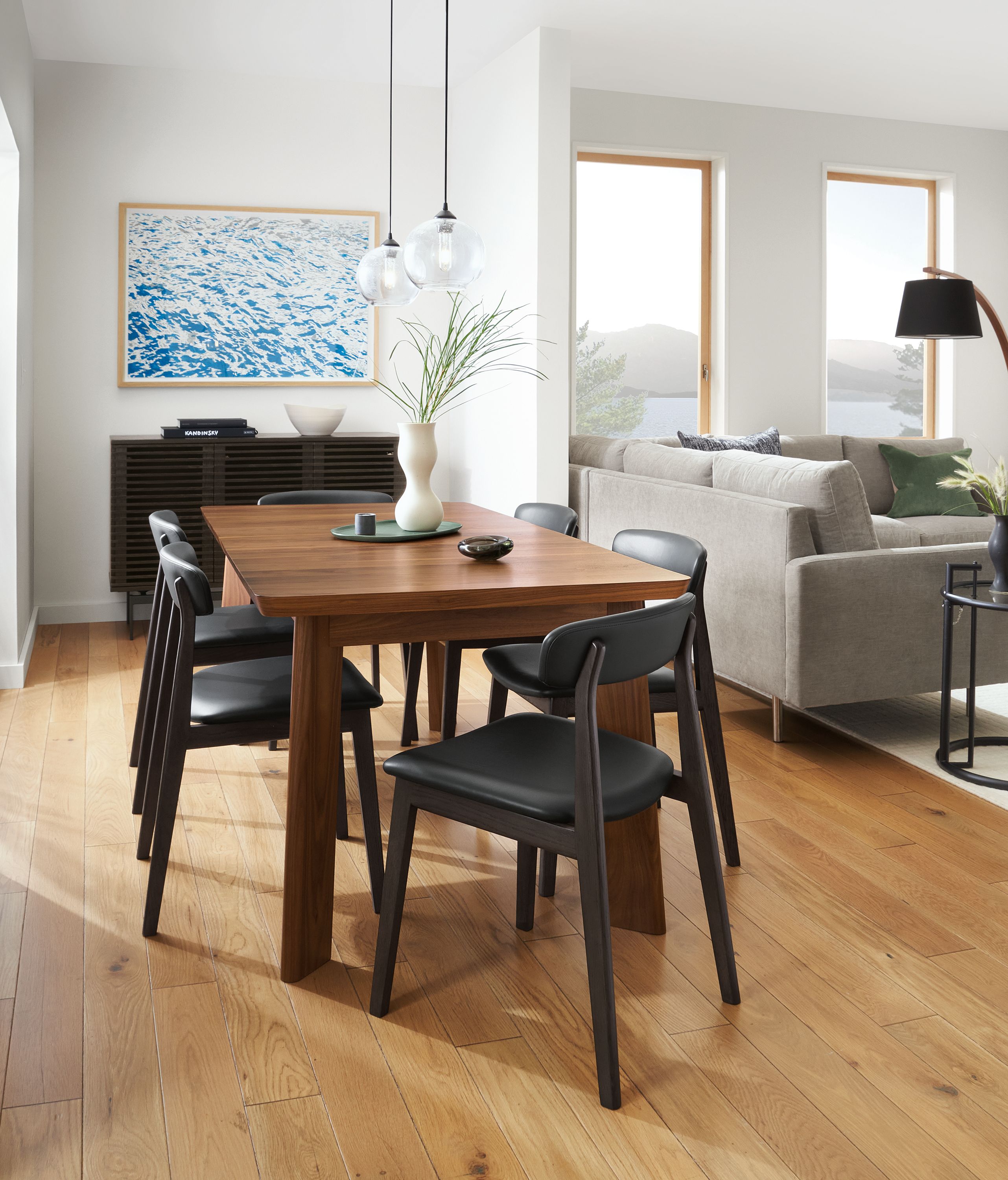 Dining area with Colby extension table in walnut and six errol dining chairs in charcoal and black.