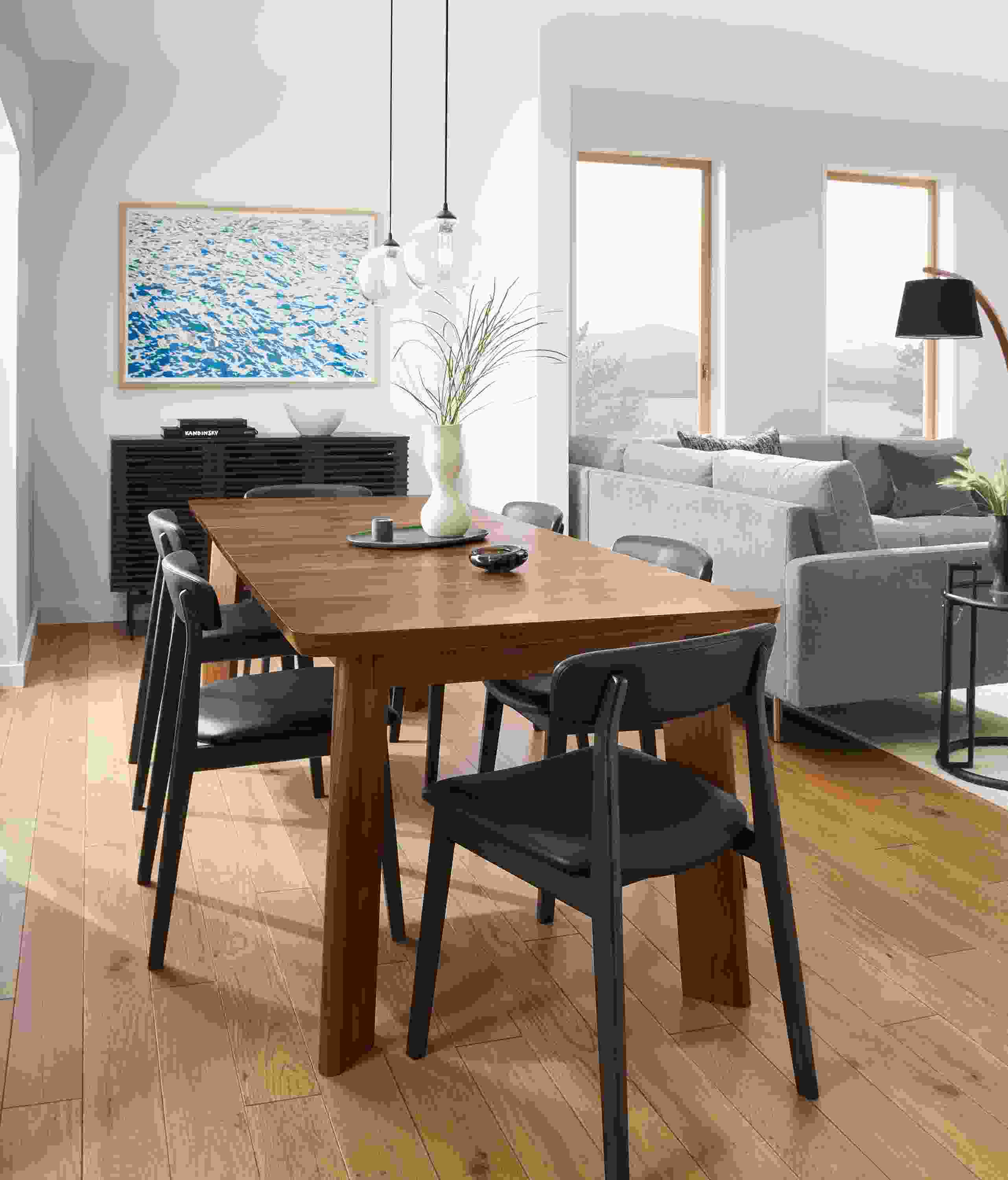 Dining room with colby extension table in walnut, errol chairs in black and coles cabinet in charcoal.