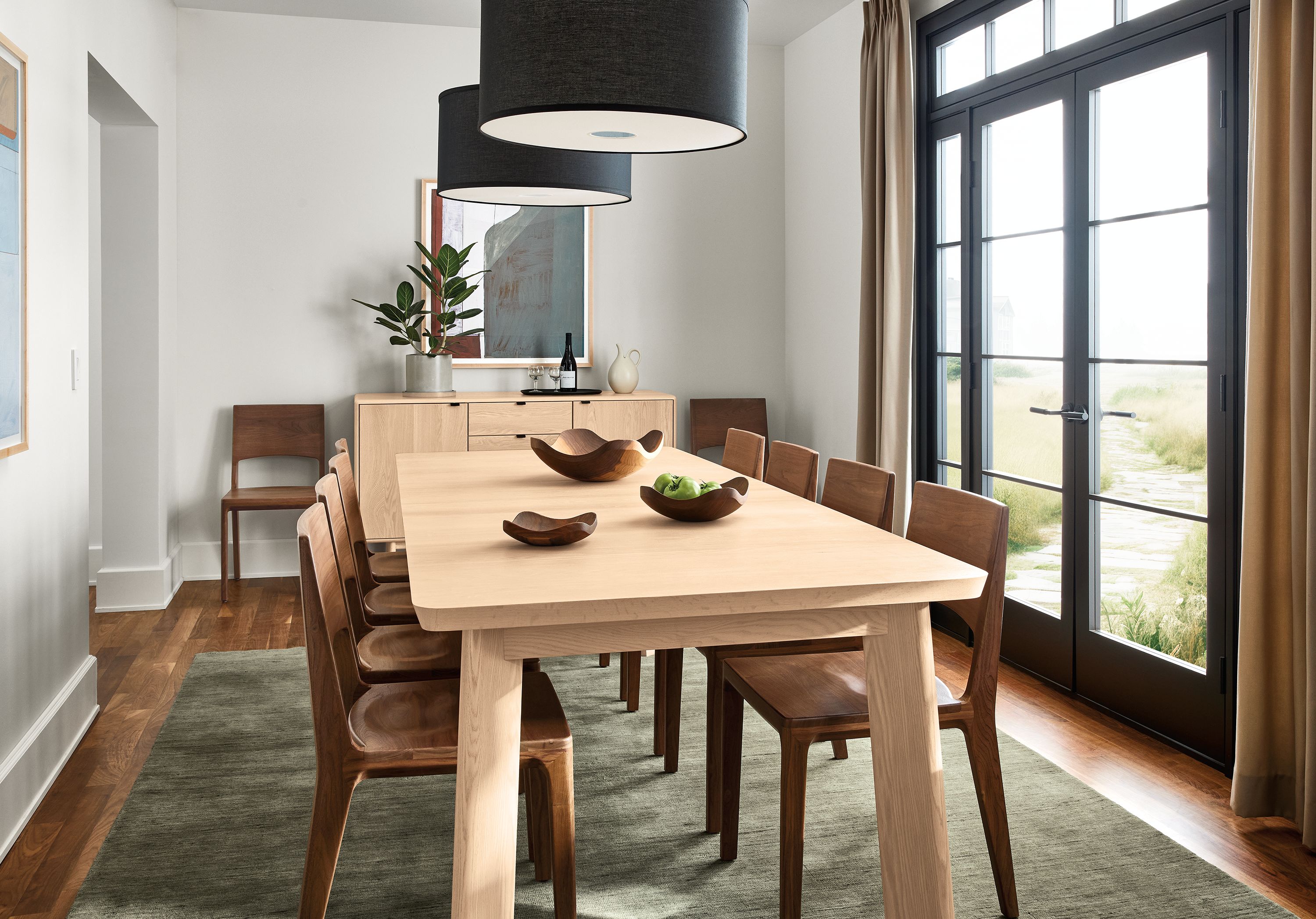 Dining room with Colby 80-wide extension table in salt on red oak and 10 Haven side chairs in walnut.