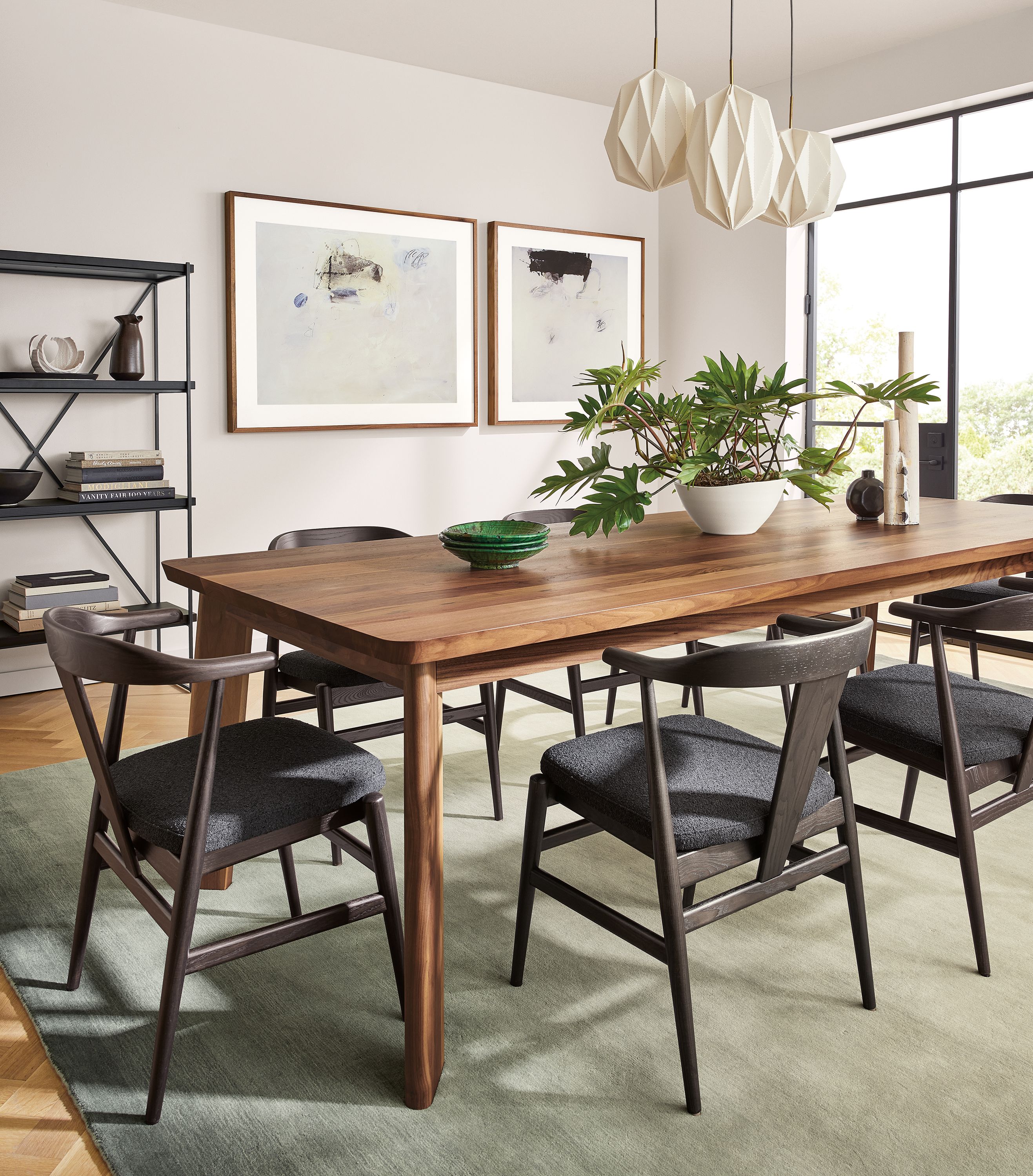 large dining room with colby table and evan chairs in charcoal with cushion.