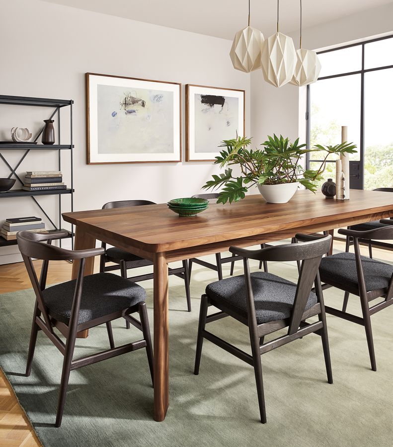 large dining room with colby table and evan chairs in charcoal with cushion.