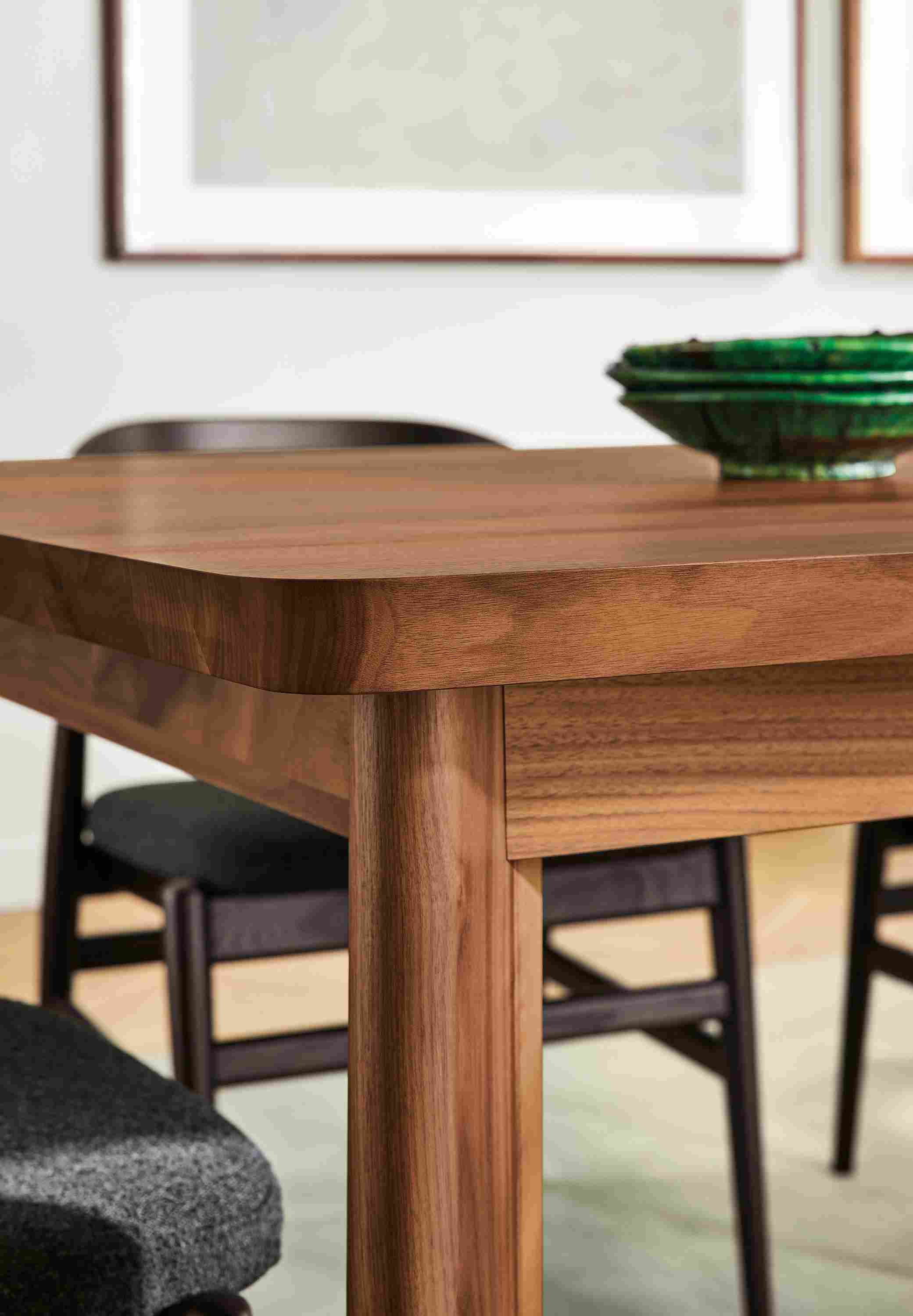 Detail of corner of Colby dining table in walnut.