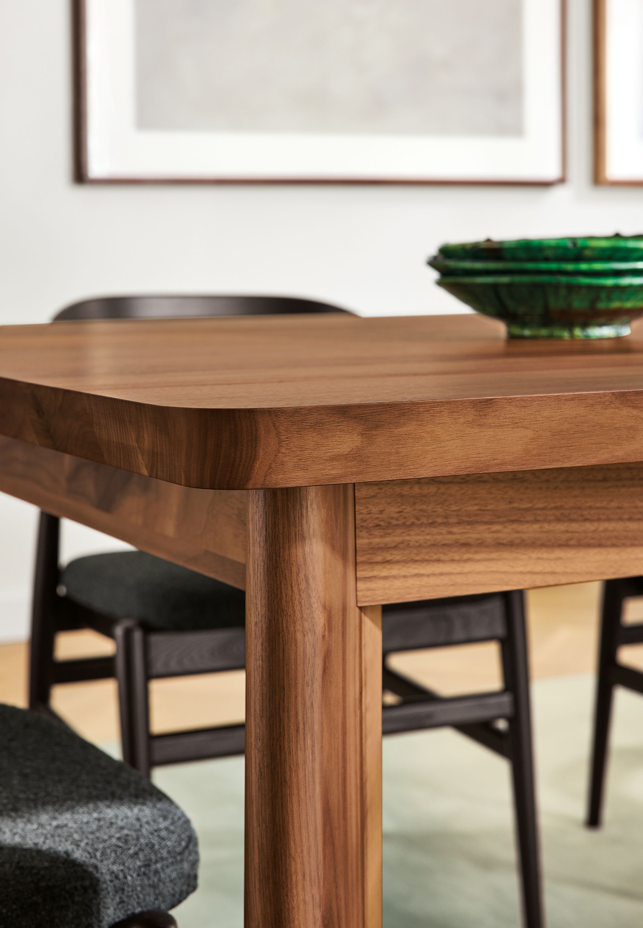 Detail of corner of Colby dining table in walnut.