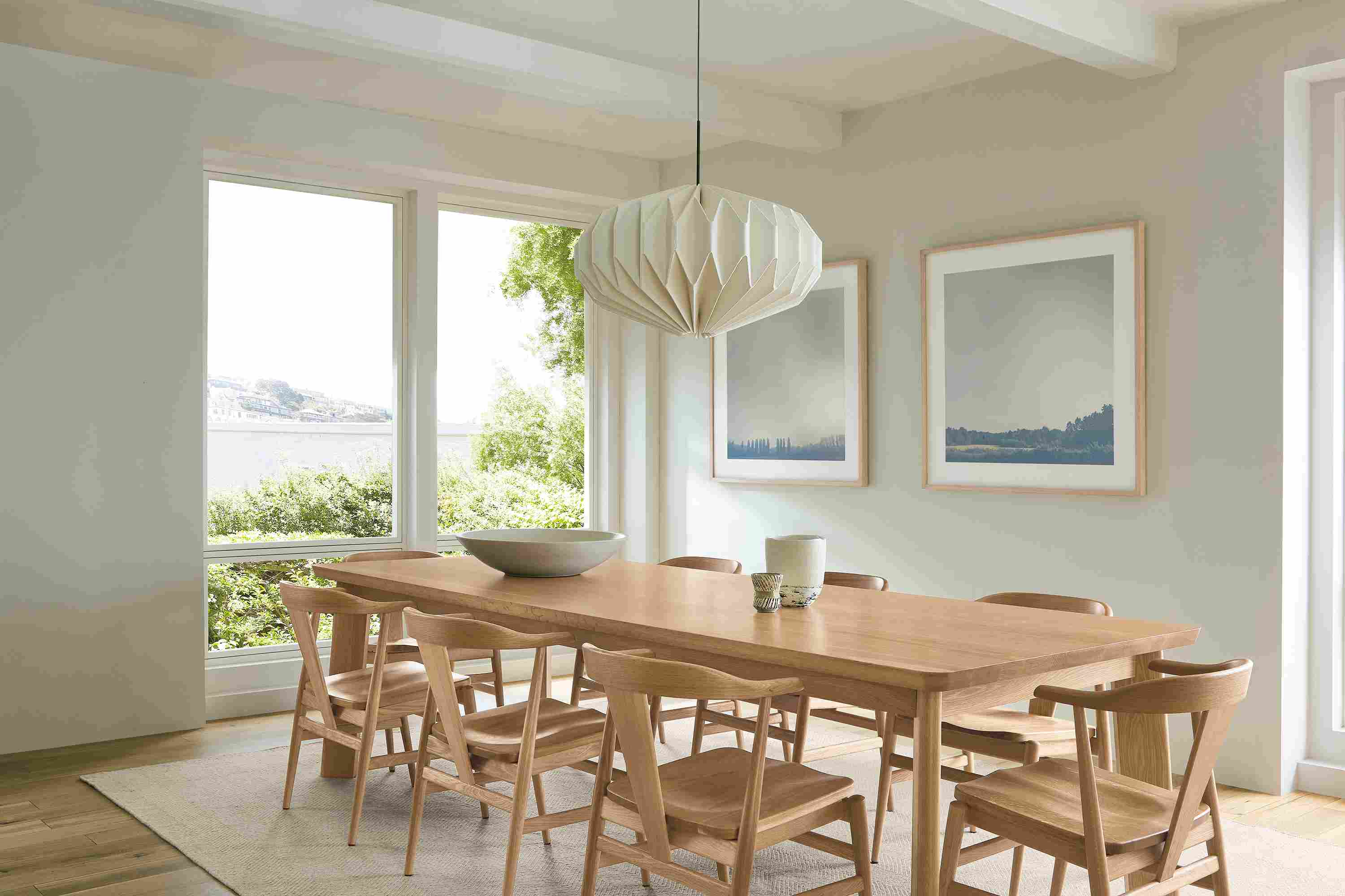 Dining room with colby 110-wide table and 8 evan arm chairs with wood seat all in rye on red oak.