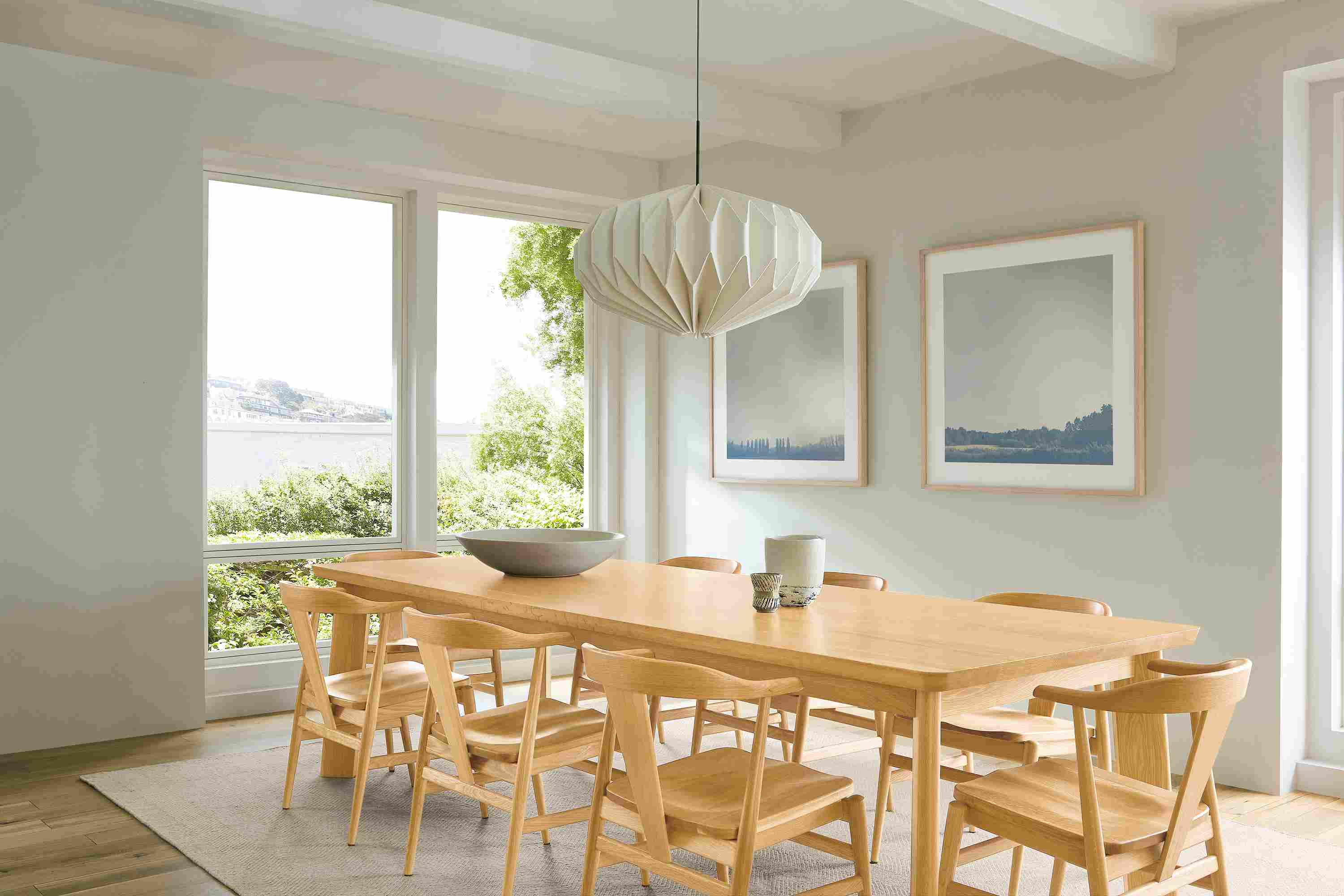 Dining room with colby 110-wide table and 8 evan arm chairs with wood seat all in white oak.