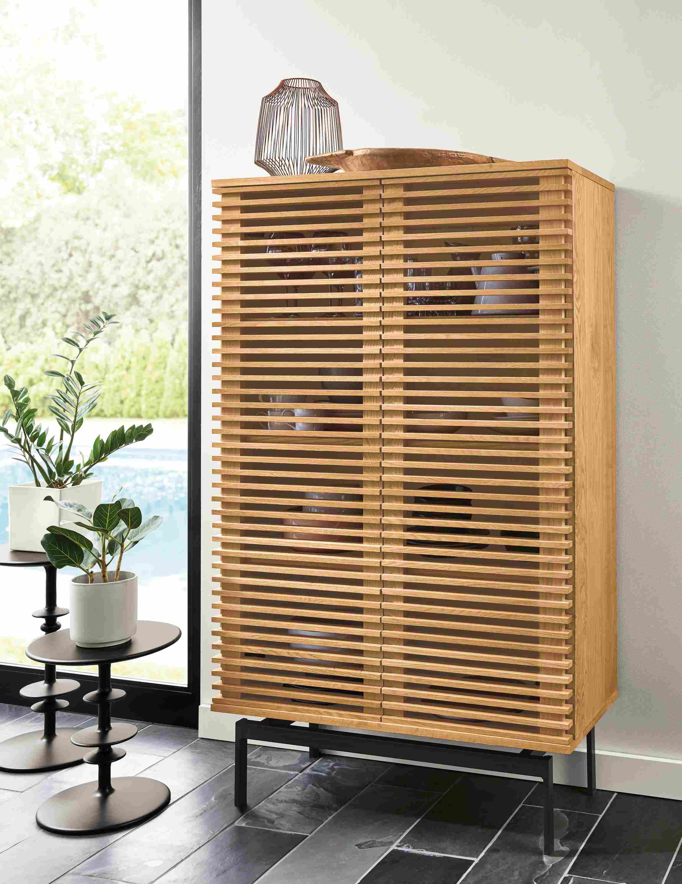 Detail of tall Coles two-door storage cabinet in white oak.