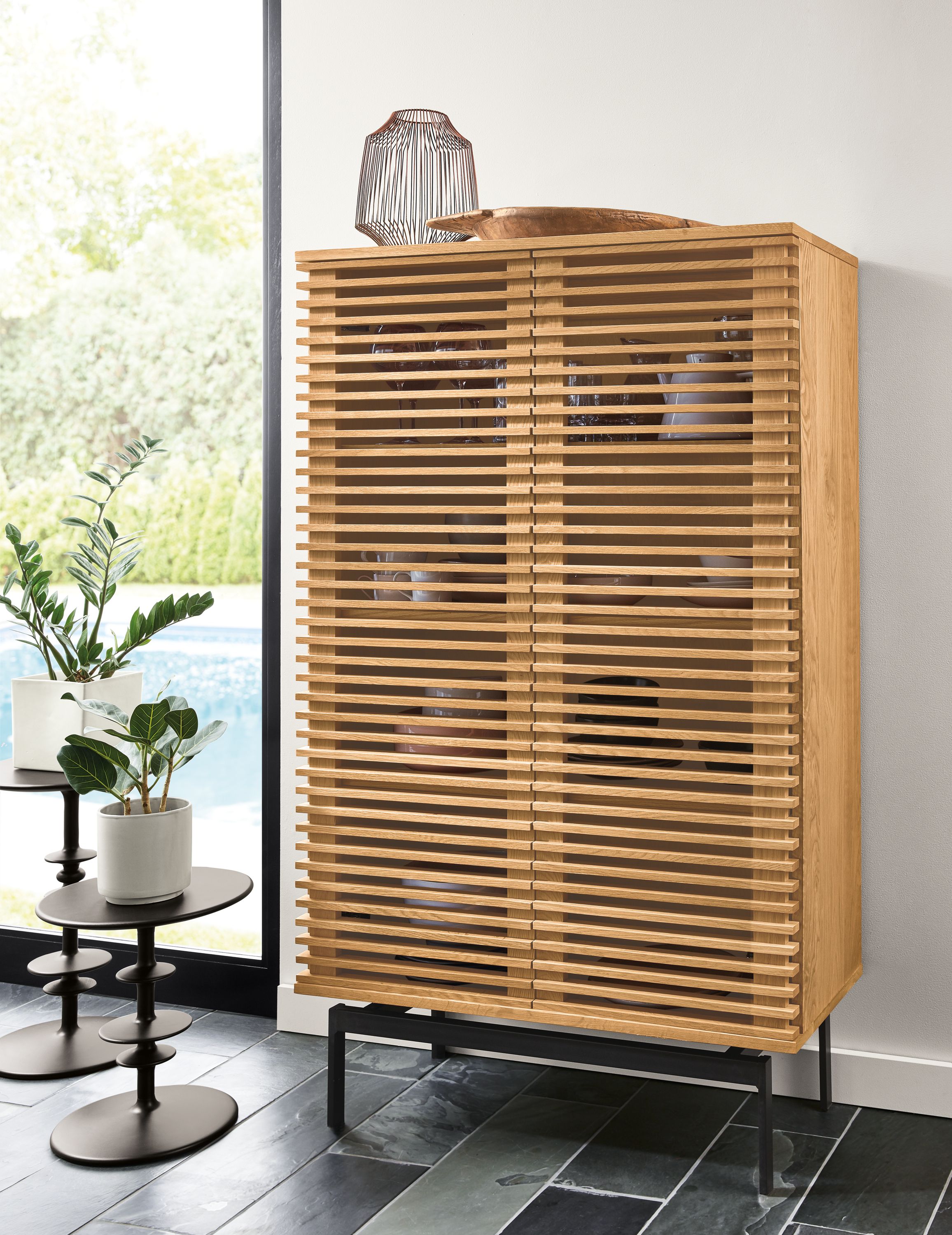 Detail of tall Coles two-door storage cabinet in white oak.