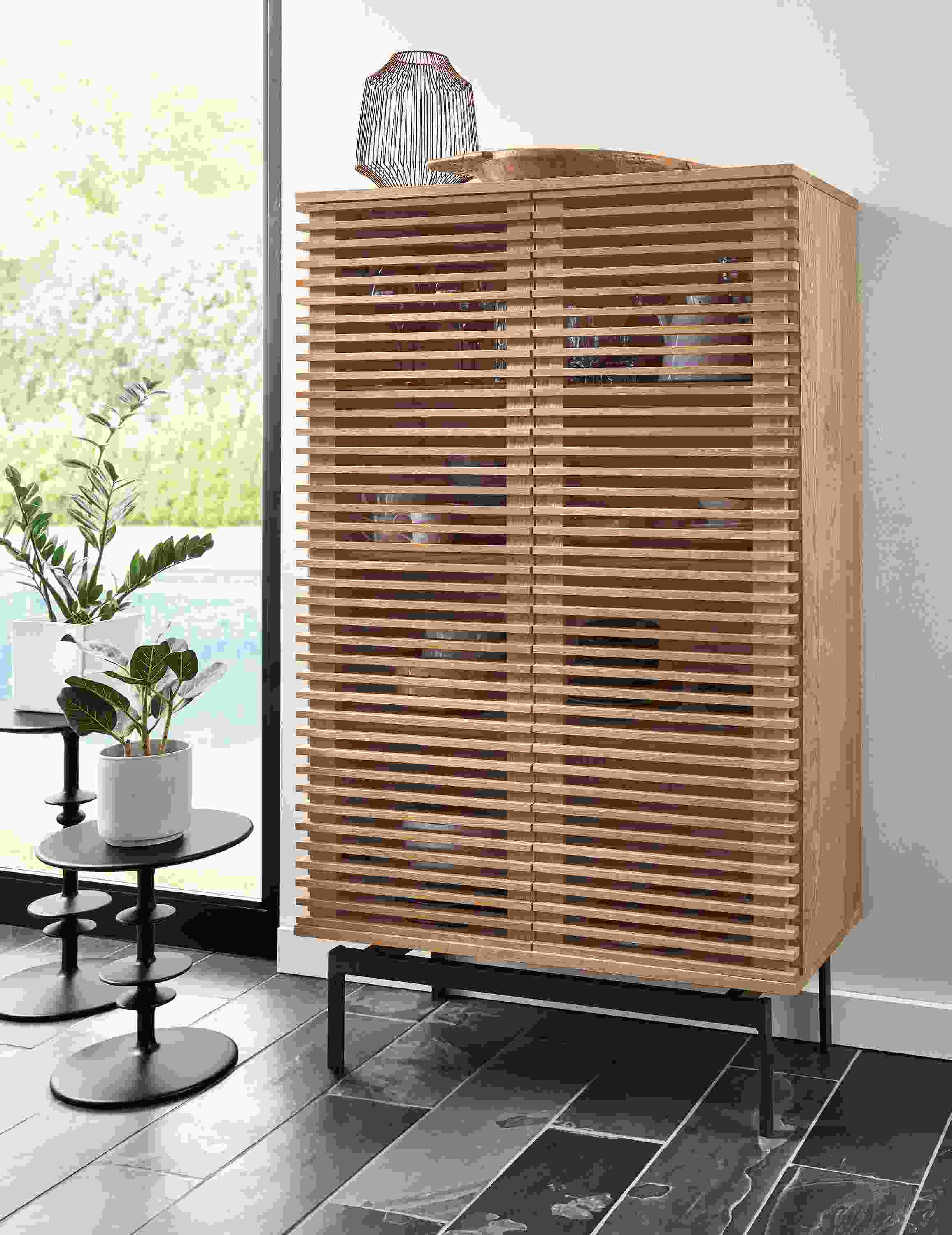 Coles 36-wide 60-high Two-Door Storage Cabinet in Rye along with 2 Parks end tables in charcoal.