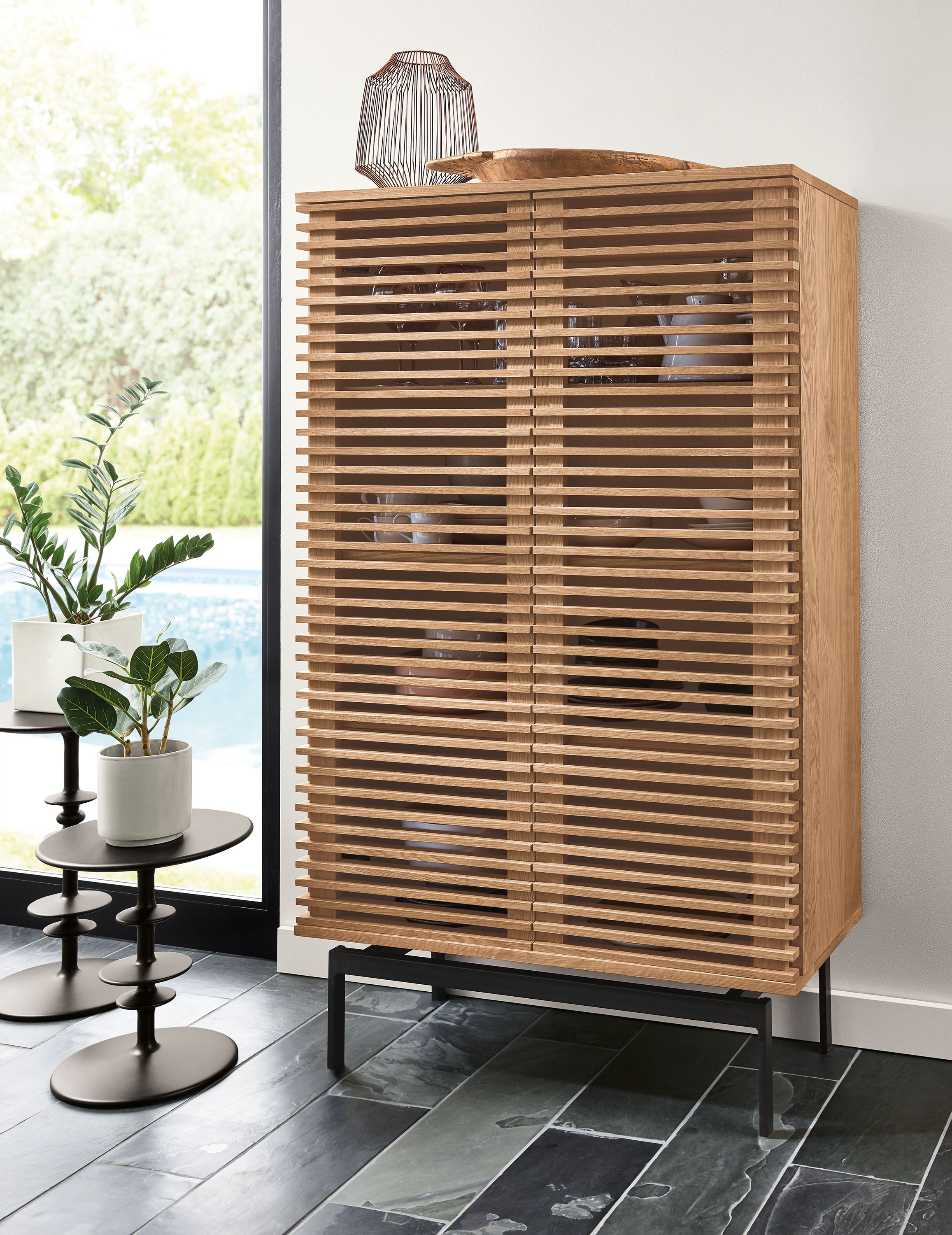 Coles 36-wide 60-high Two-Door Storage Cabinet in Rye along with 2 Parks end tables in charcoal.