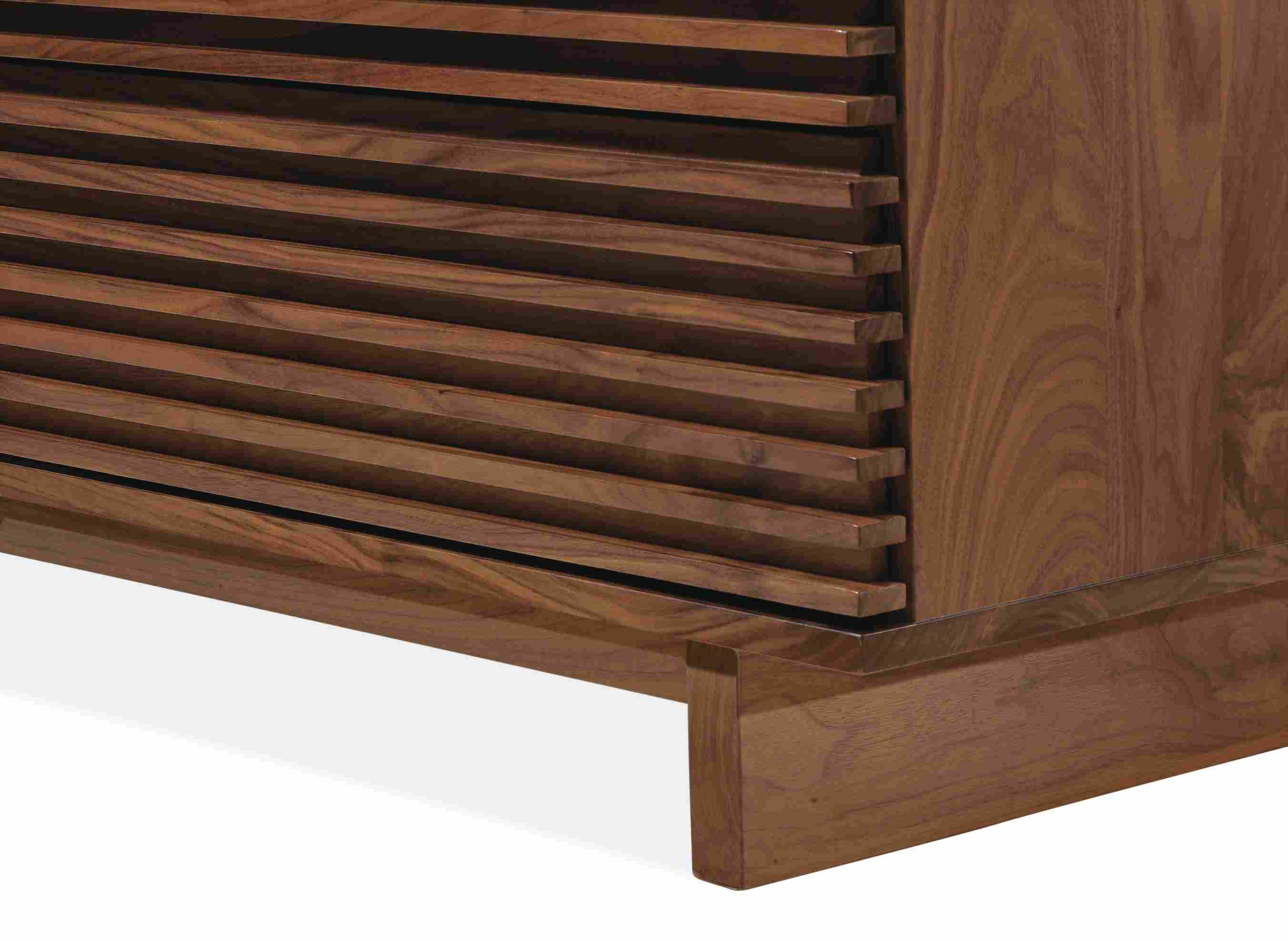 Close-up of bottom corner of Coles 72-wide ten-drawer dresser in walnut.