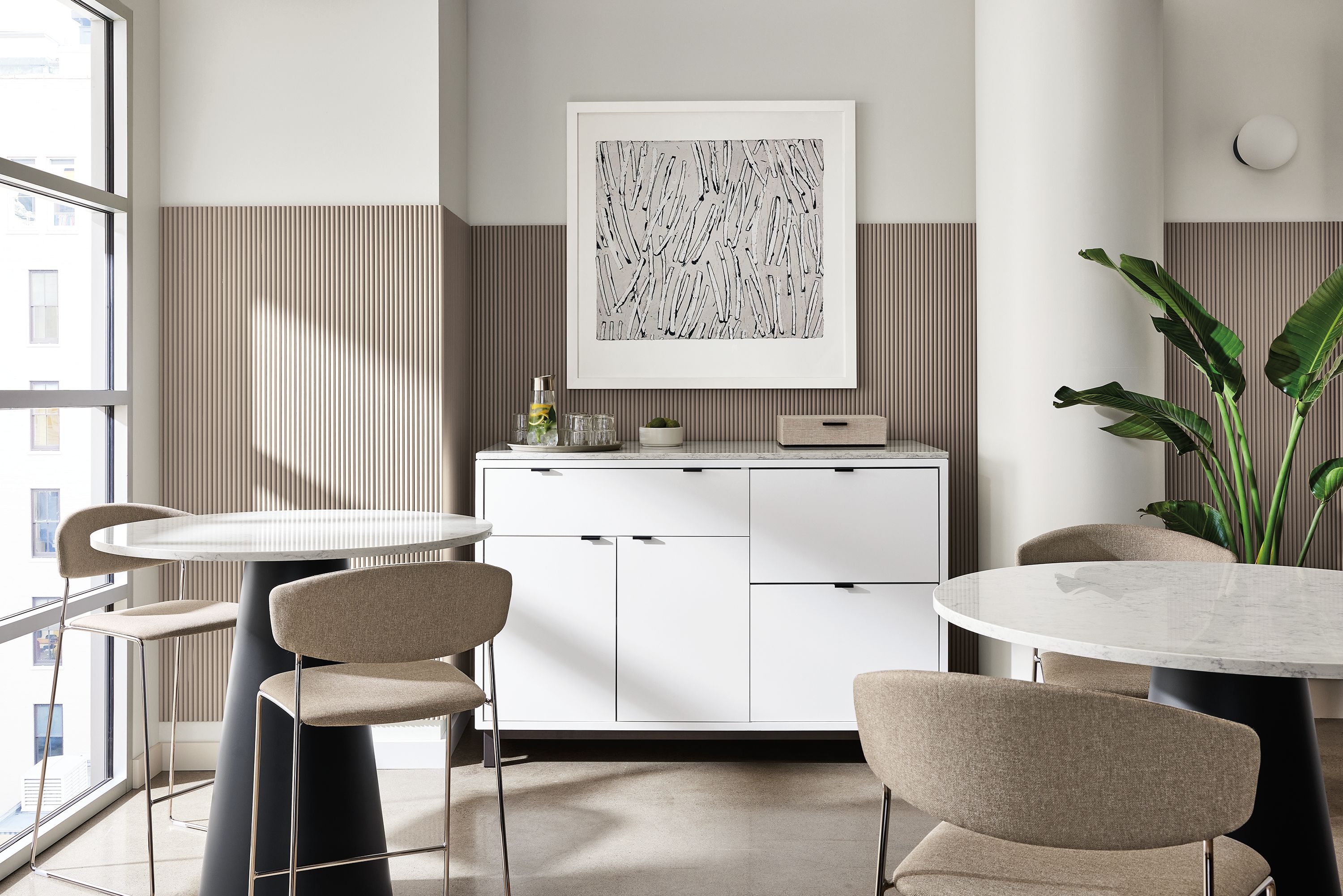 36 diam tables with marbled white quartz top, graphite base