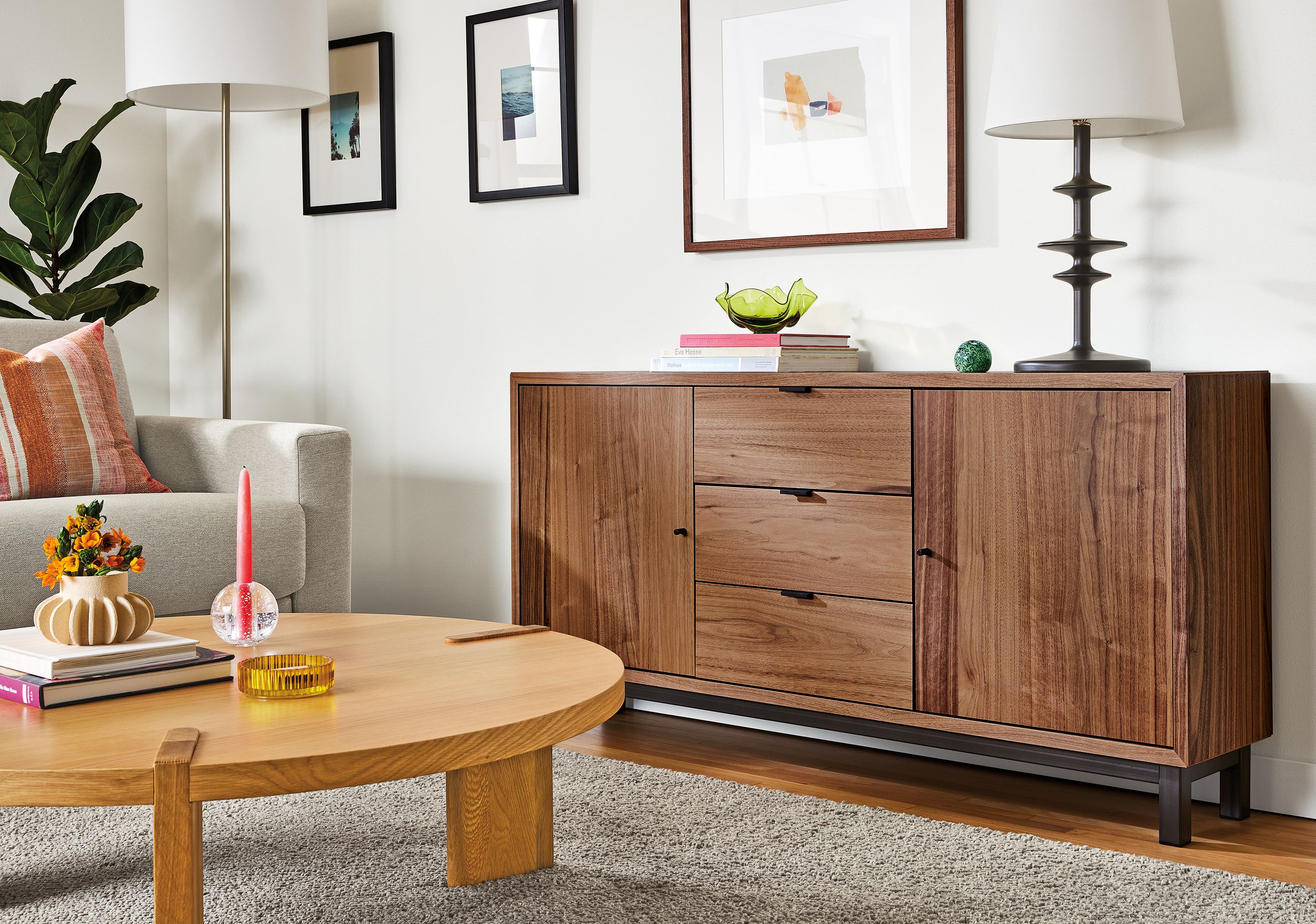 Living room area with Copenhagen 60-wide console cabinet in walnut, Hanover coffee table in white oak and Parks table lamp in charcoal.