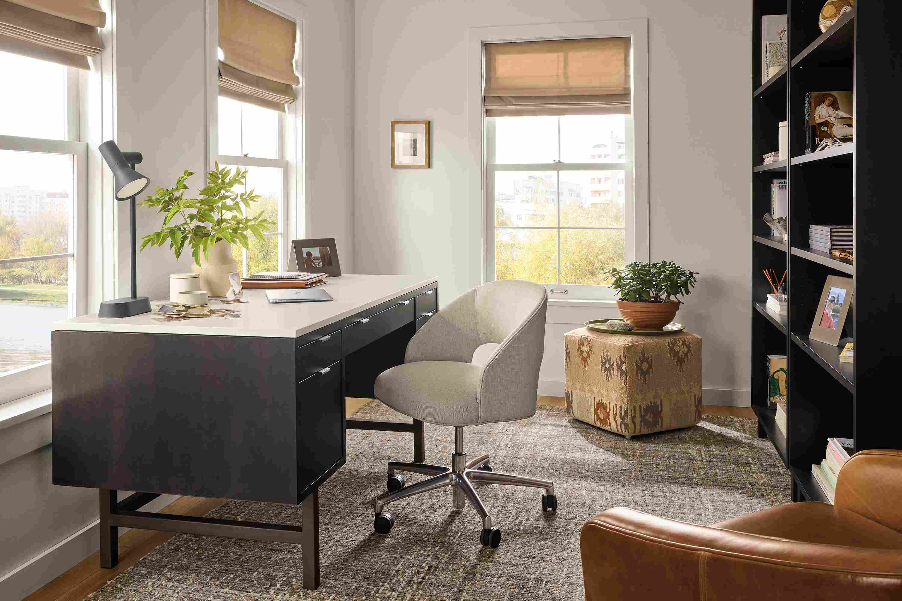 Home office with Copenhagen 60-wide desk in charcoal, Esme chair in Sumner Linen and Ravani rug in charcoal.