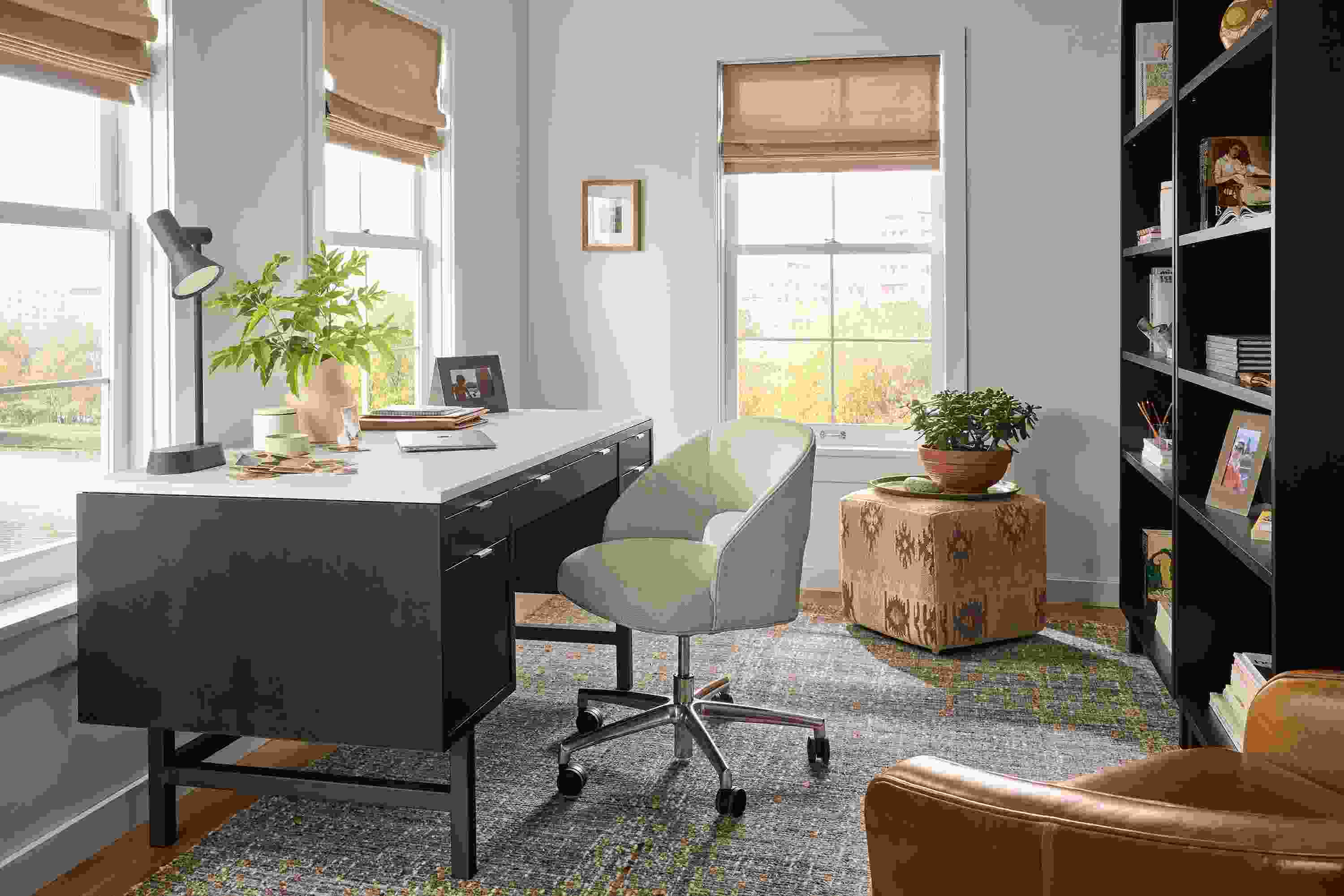 Home office with Copenhagen 60-wide desk in charcoal, Esme chair in Sumner Linen and Ravani rug in charcoal.