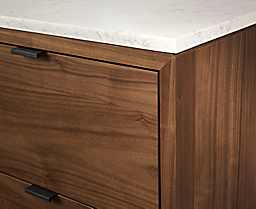 Close up detail of Copenhagen dining cabinet in walnut with marbled white quartz top.