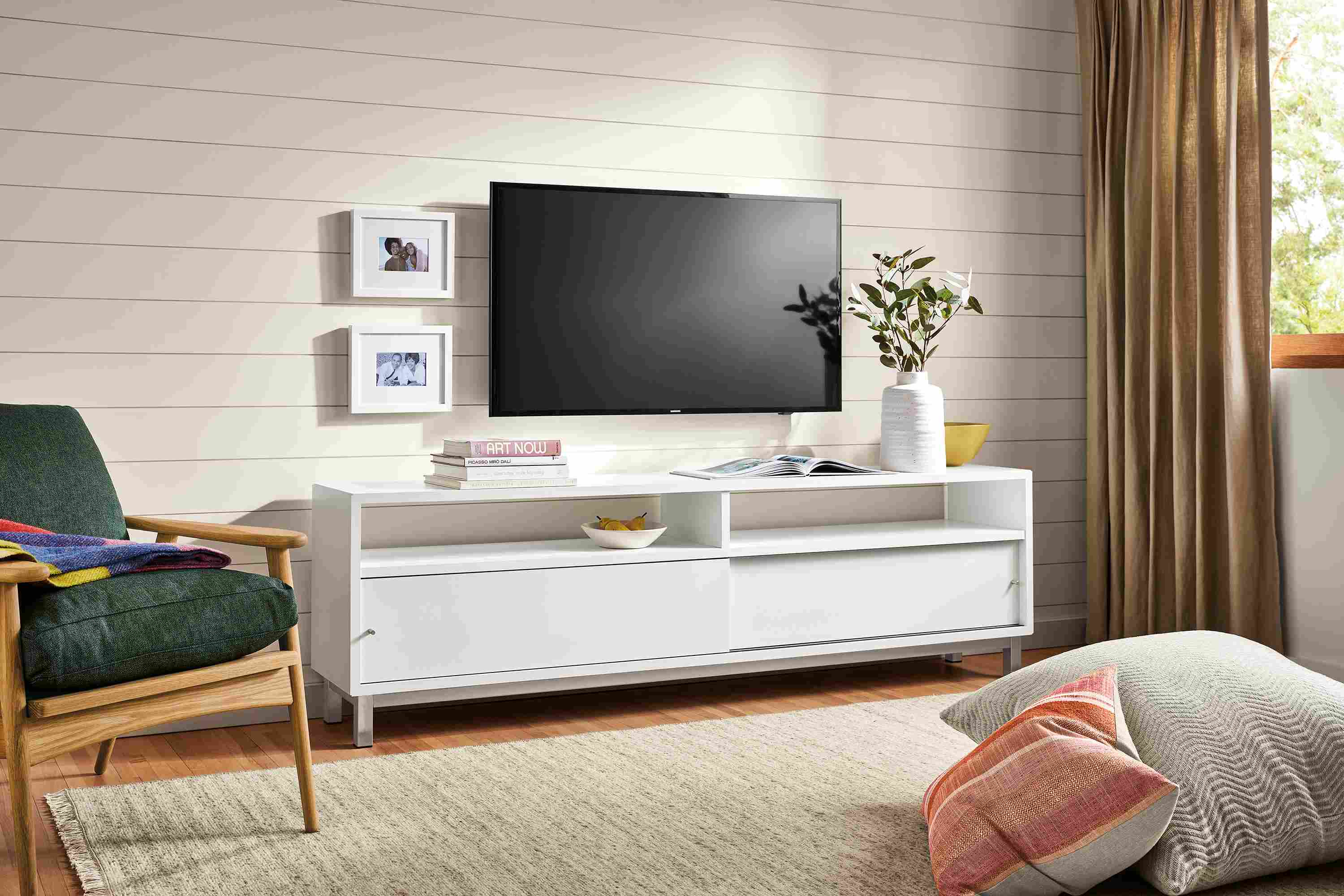 Living room with Copenhagen media cabinet, Ericson lounge chair and floor pillows.