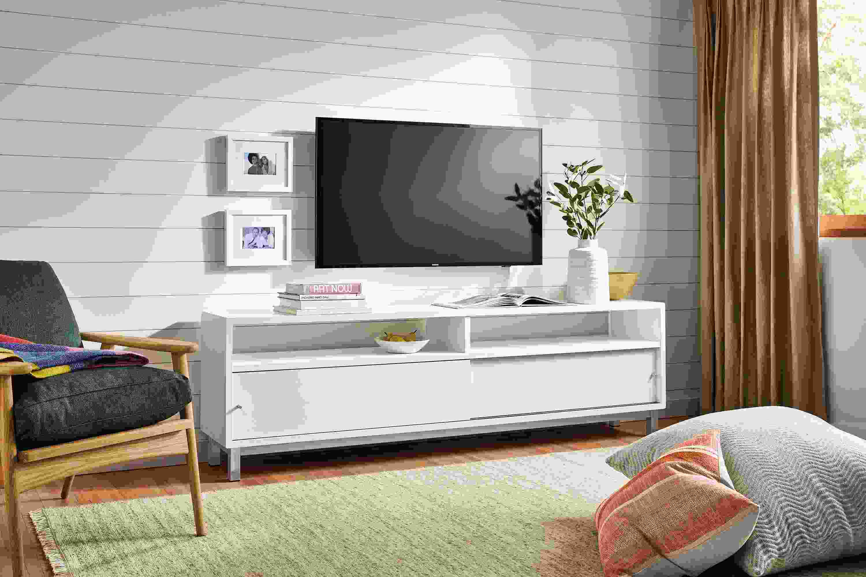 Living room with Copenhagen media cabinet, Ericson lounge chair and floor pillows.