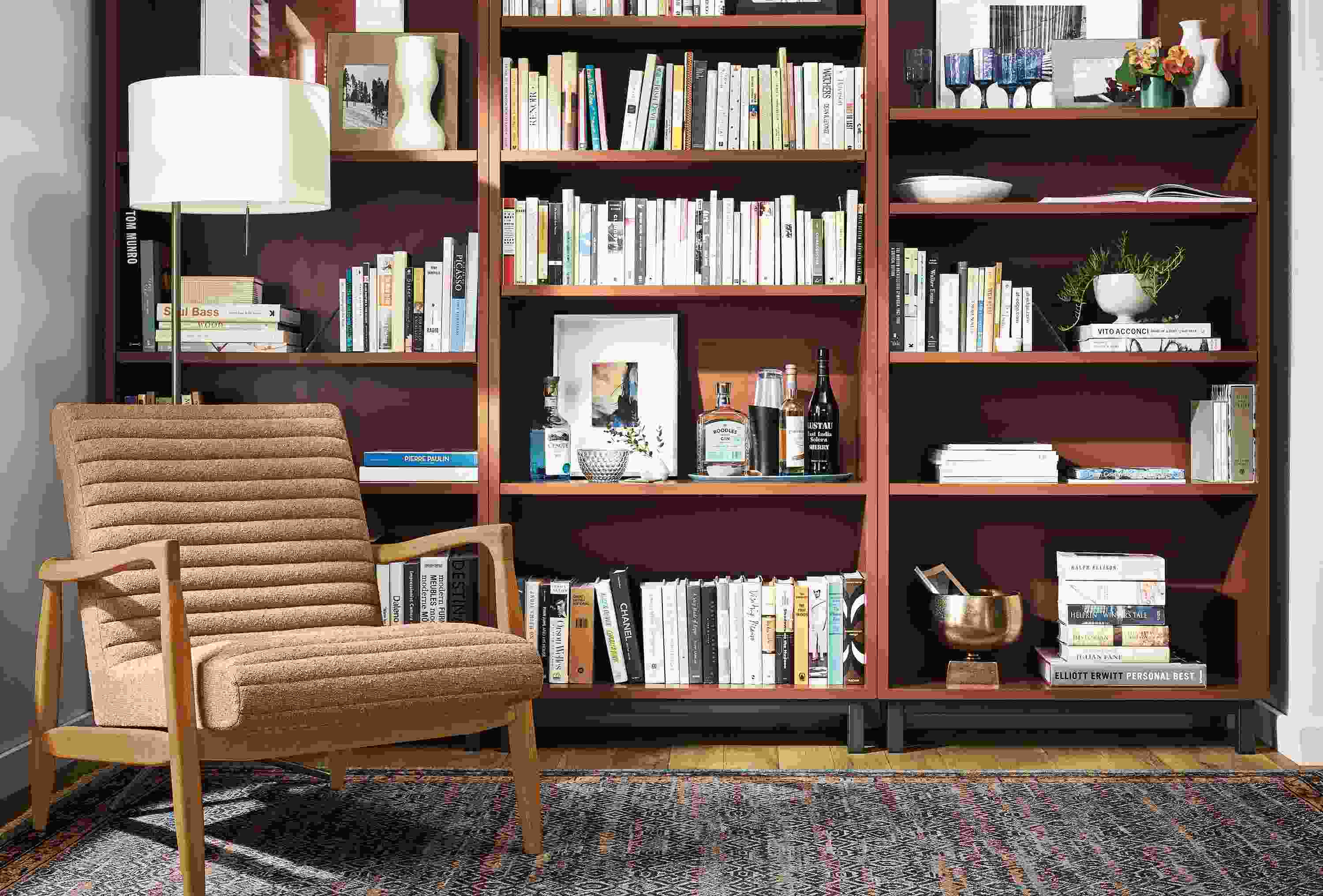 Detail of 3 Copenhagen bookcases in Cognac side by side.