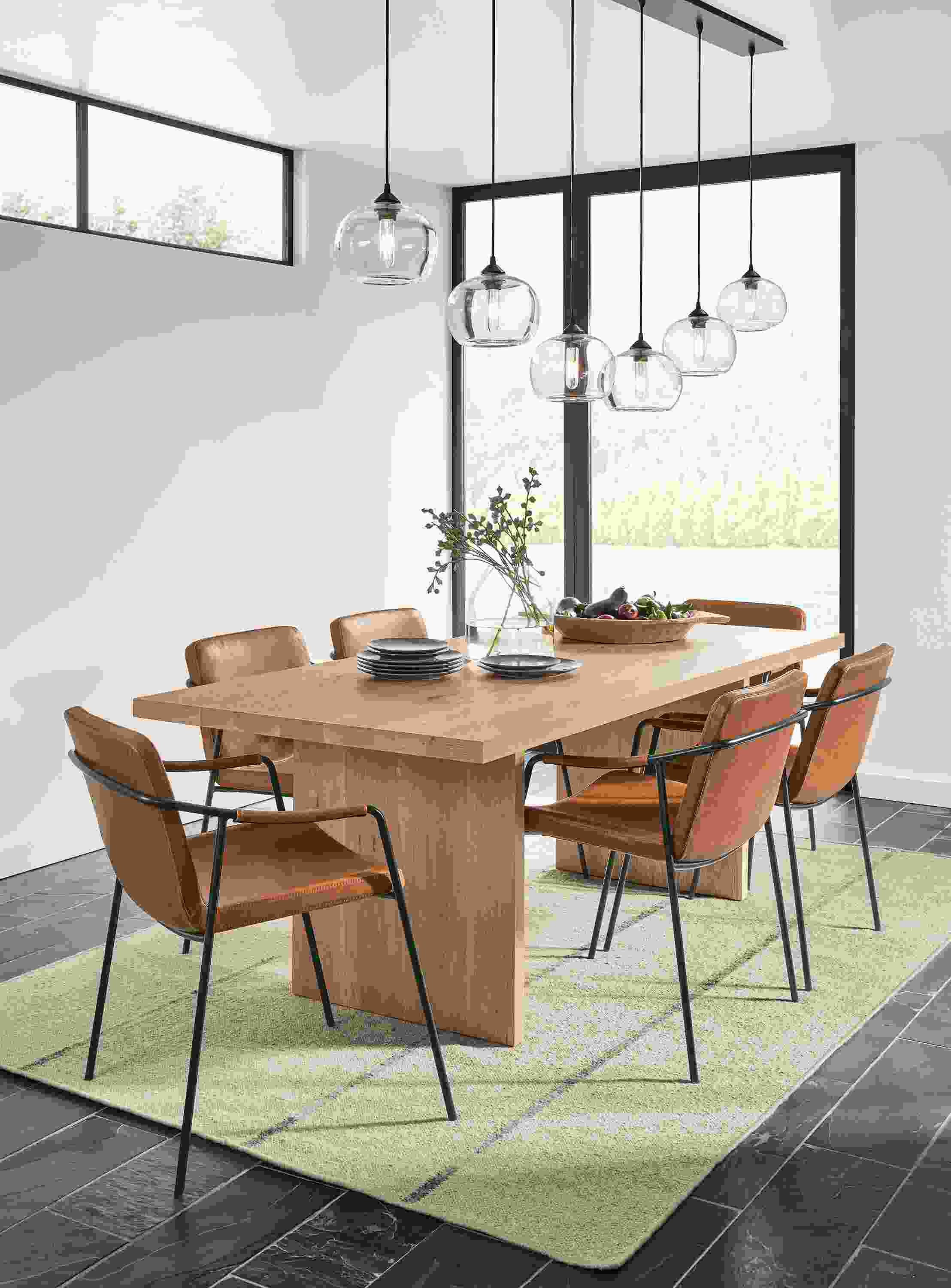 Dining room with corbett table in rye on red oak and 6 mazie chairs in brown synthetic leather.