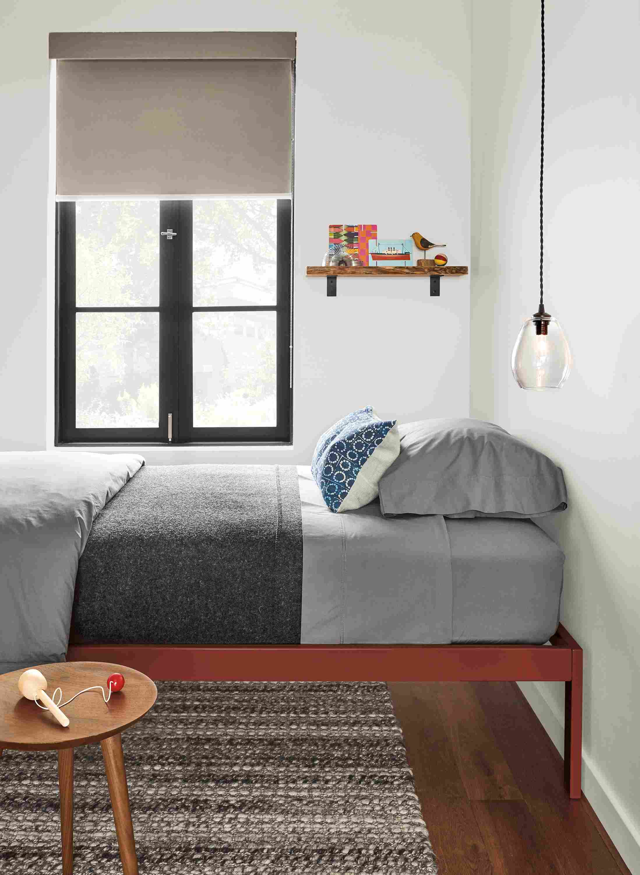 Bedroom with detail of Core twin bed in brick powdercoat.