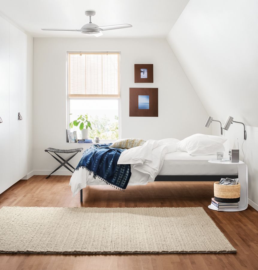 Detail of Core platform bed in small minimal bedroom.