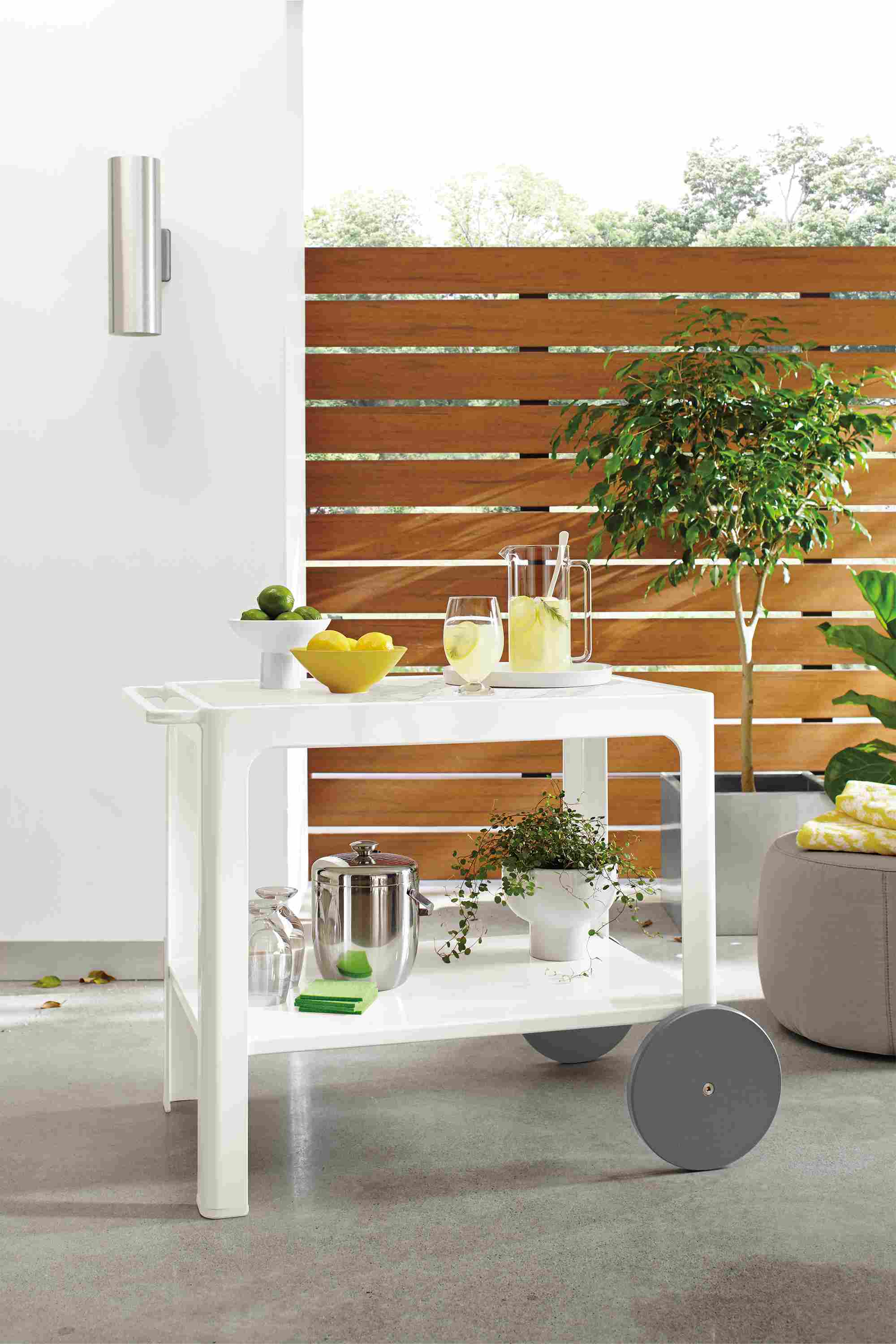 Patio with crescent bar cart in white.