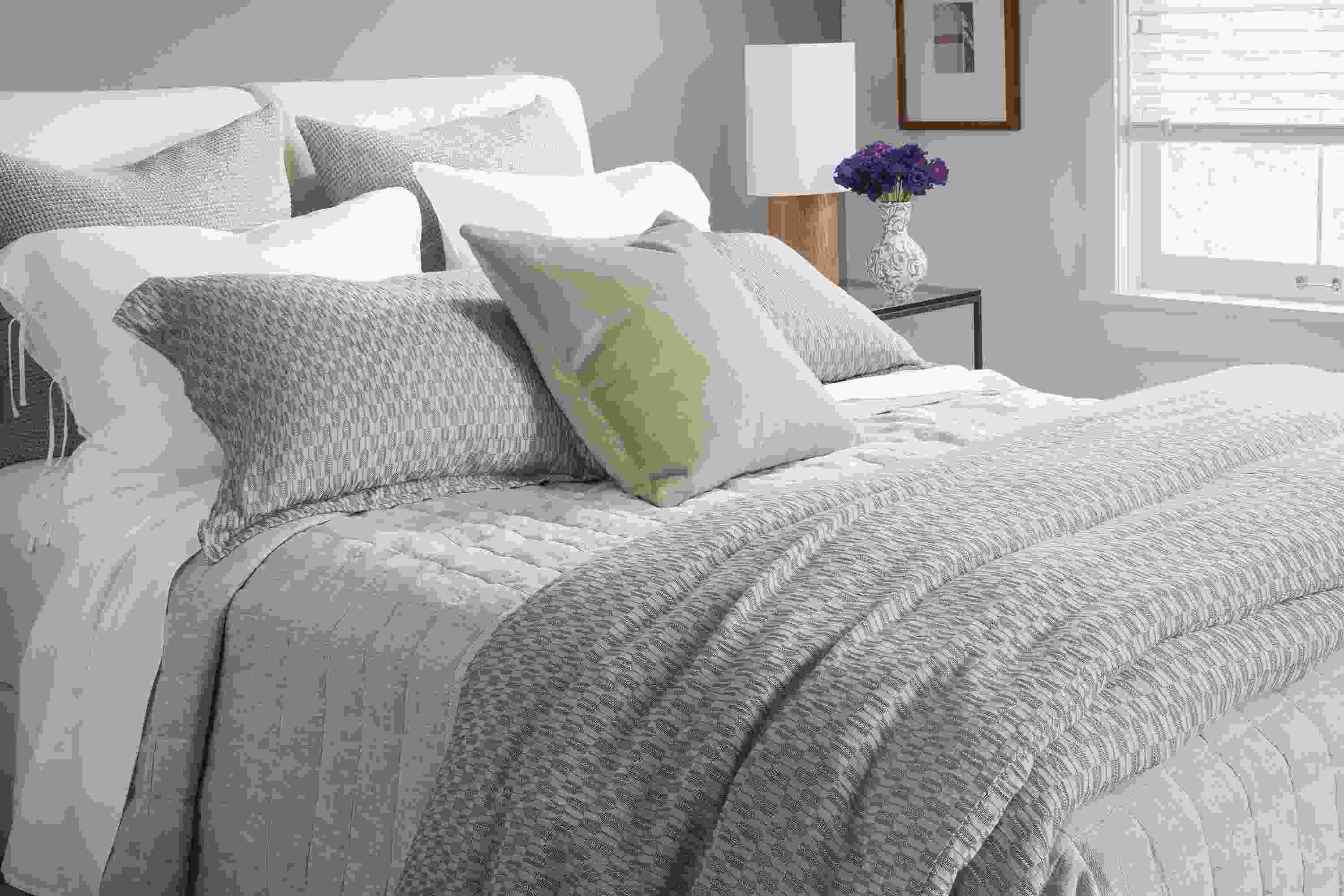 Bedroom with crofton duvet set in grey, relaxed linen coverlet in grey chambray on a nora queen bed.