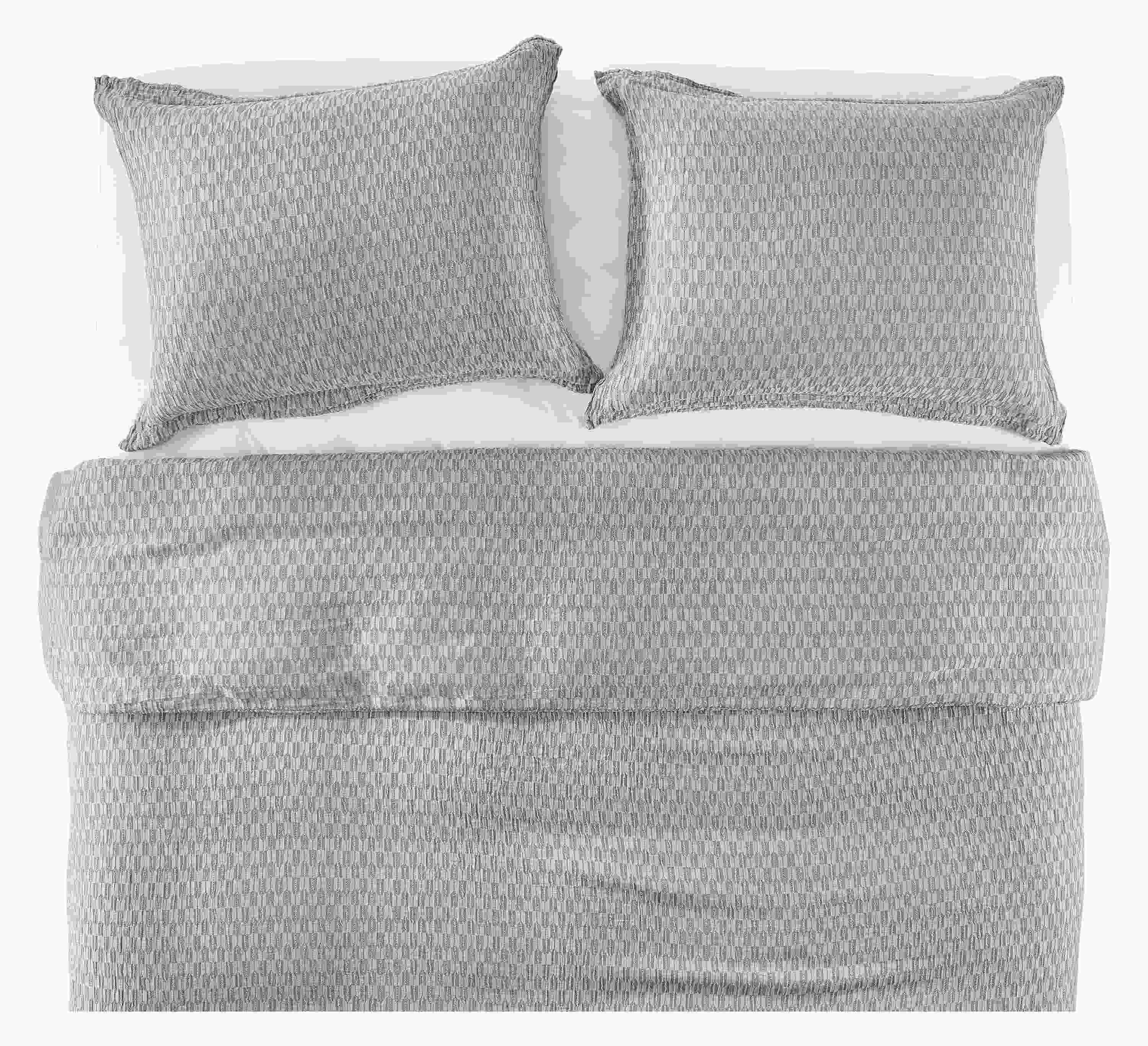 Overhead view of core queen bed with crofton duvet set in grey and signature percale sheets in white.