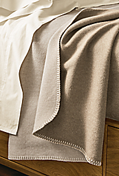 Detail of Cunningham queen blanket in Natural/Bisque on Hudson bed.