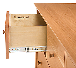 Detail of drawer slide on a Danbury ten-drawer dresser in Cherry.