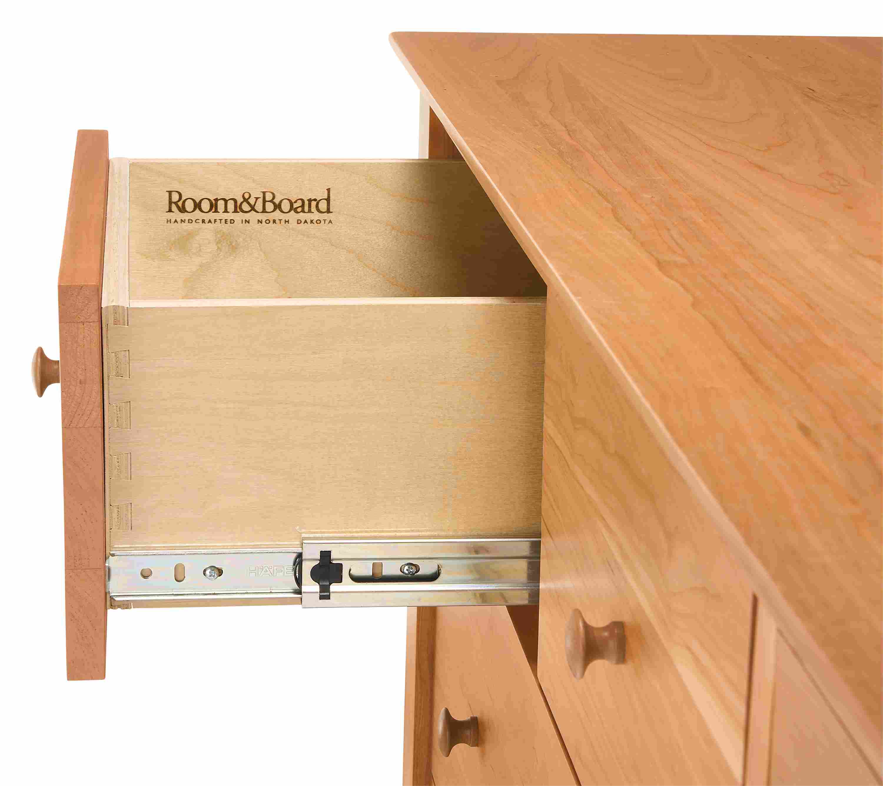 Detail of drawer slide on a Danbury ten-drawer dresser in Cherry.