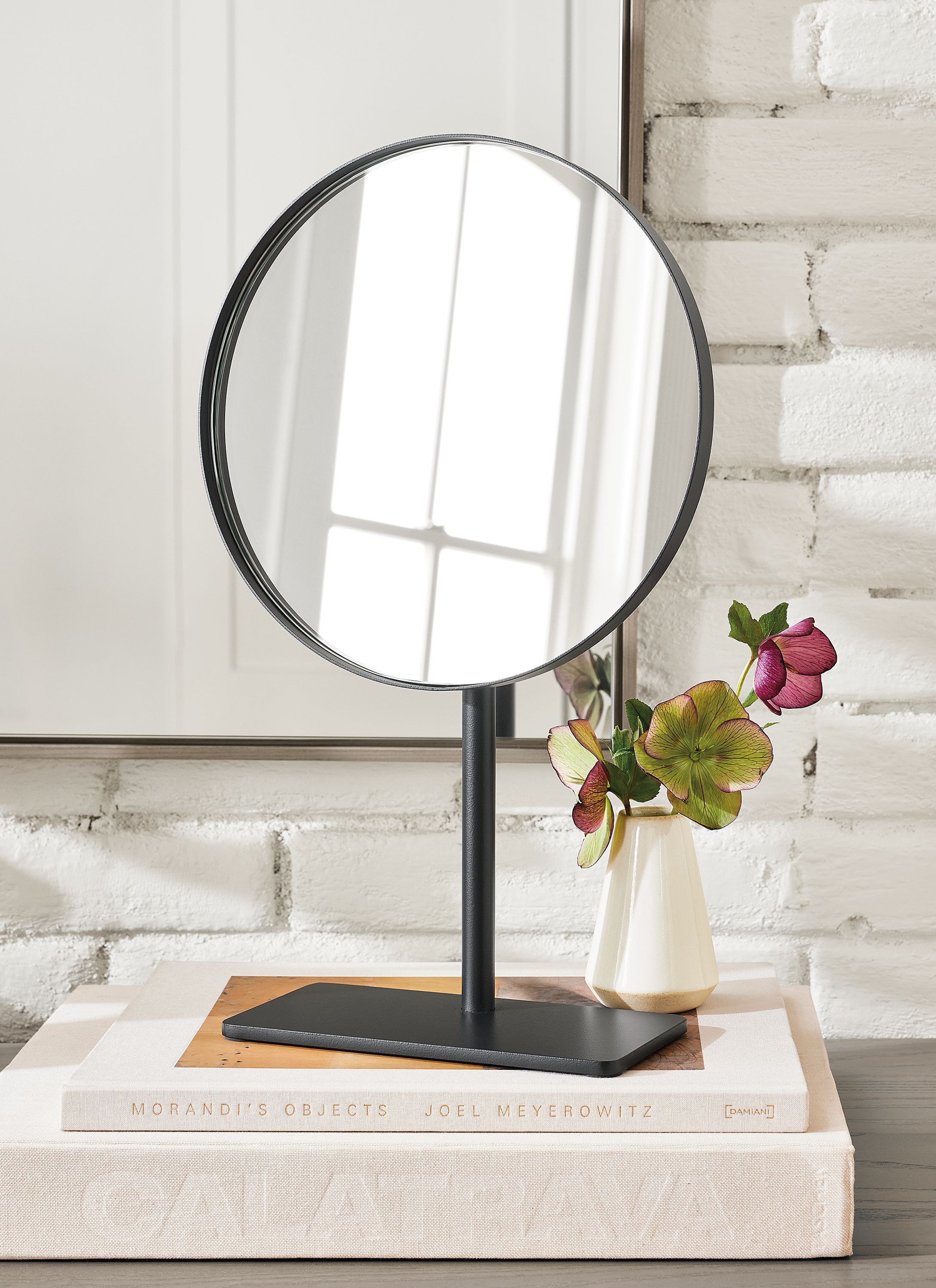 Detail of Dawn round tabletop mirror on dresser.