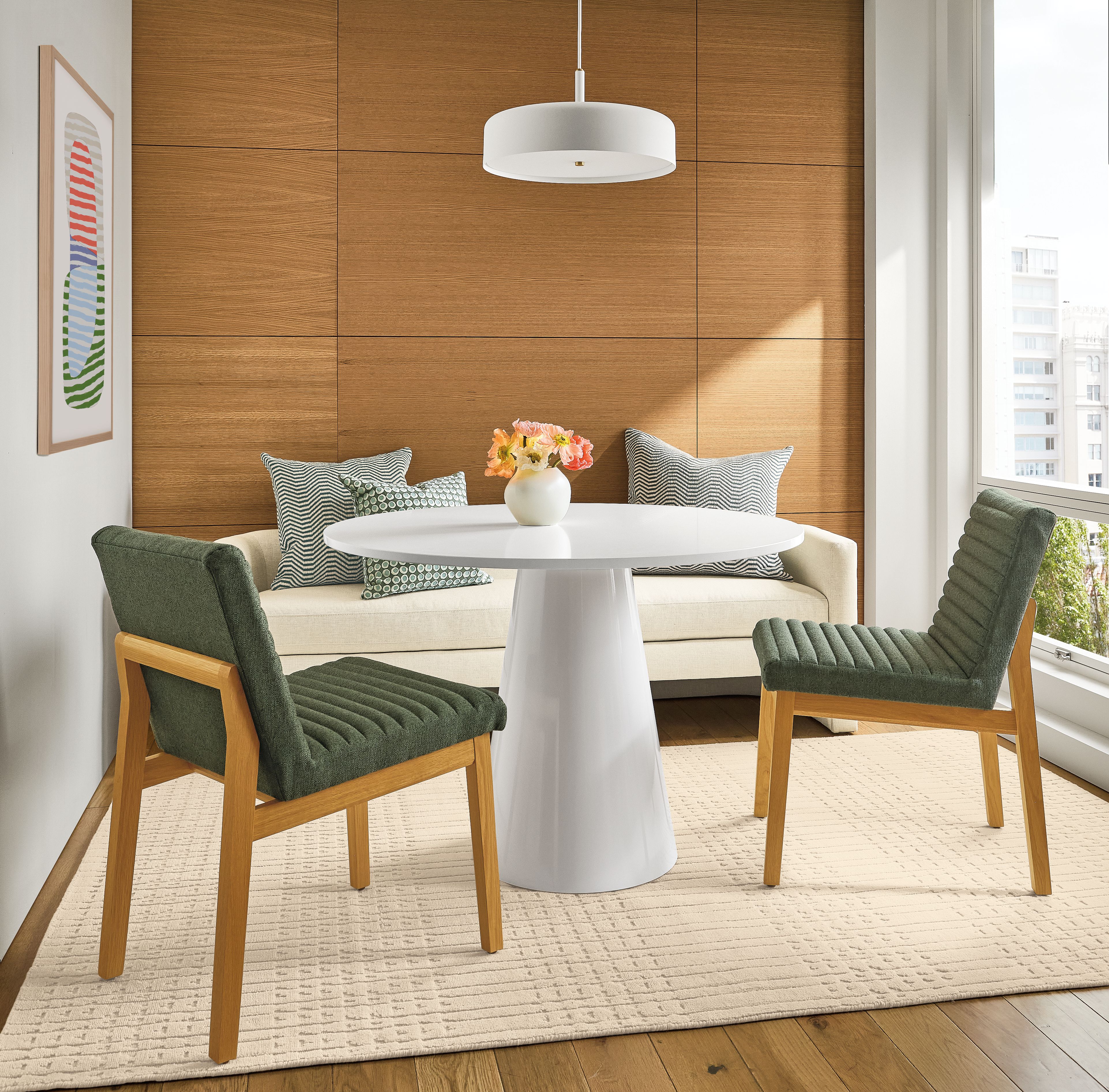 Seating area with Decker 48-diameter table in white with white quartz and Olsen side chairs in Hines Spruce.