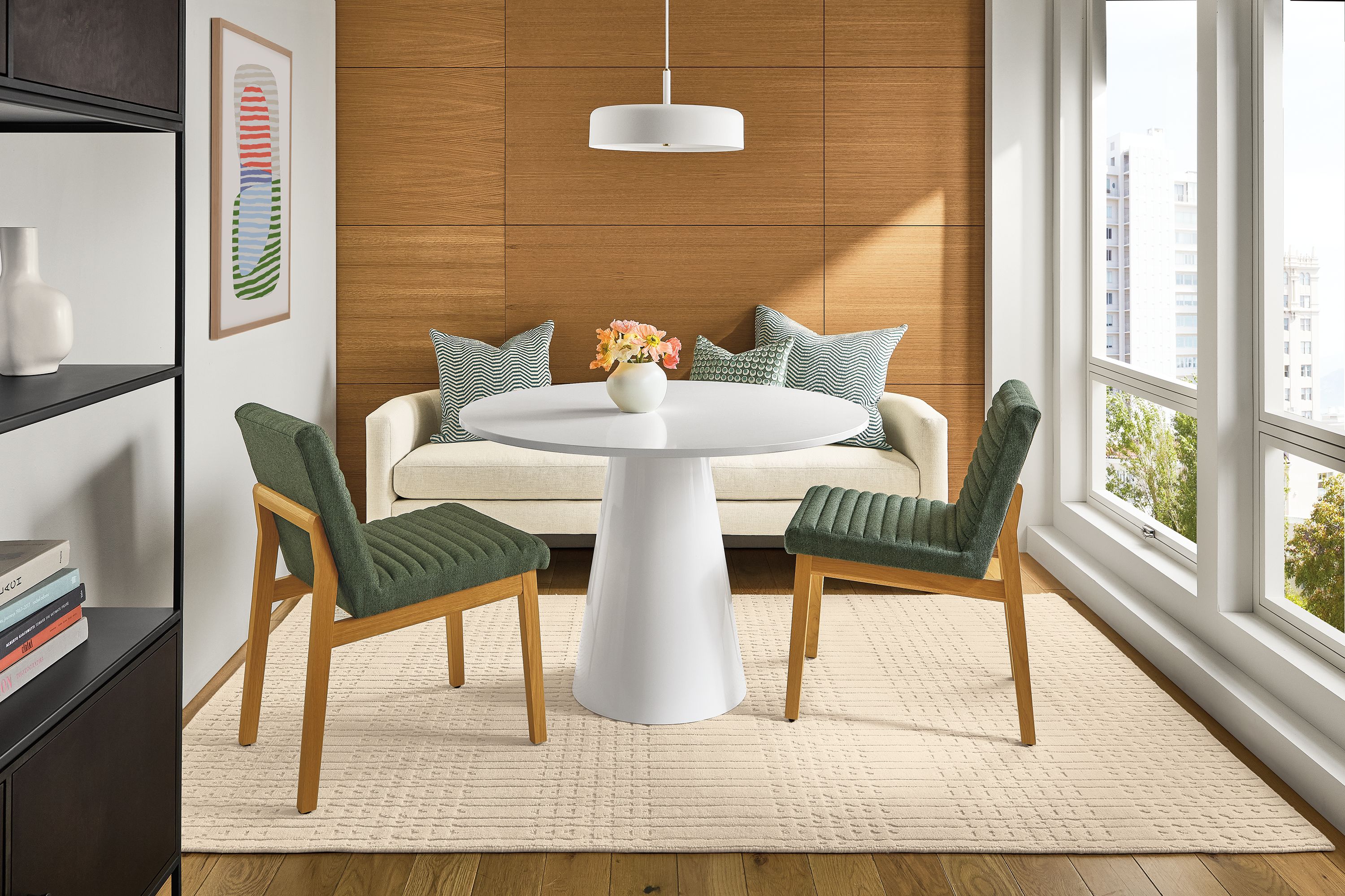 Small seating area with Decker round table in white with white quartz and Silva bench in Sumner Ivory.