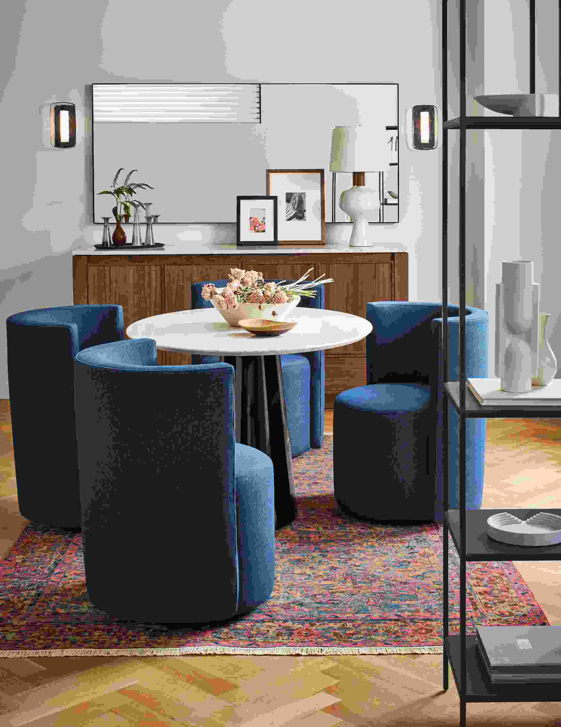 Home dining area with 4 Como dining chairs in flint ink and Decker oval table in onyx gloss with quartz top.