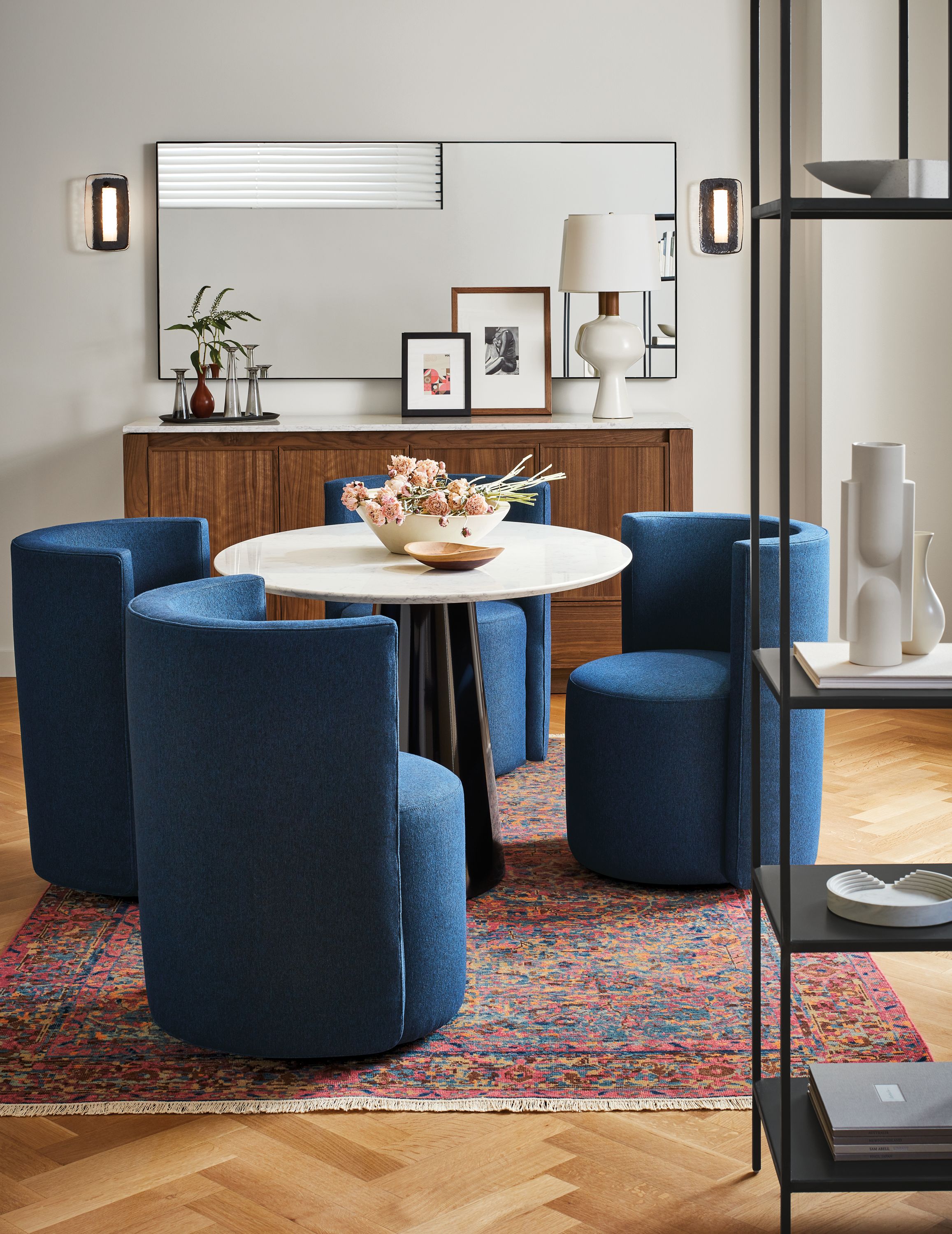 Home dining area with 4 Como dining chairs in flint ink and Decker oval table in onyx gloss with quartz top.