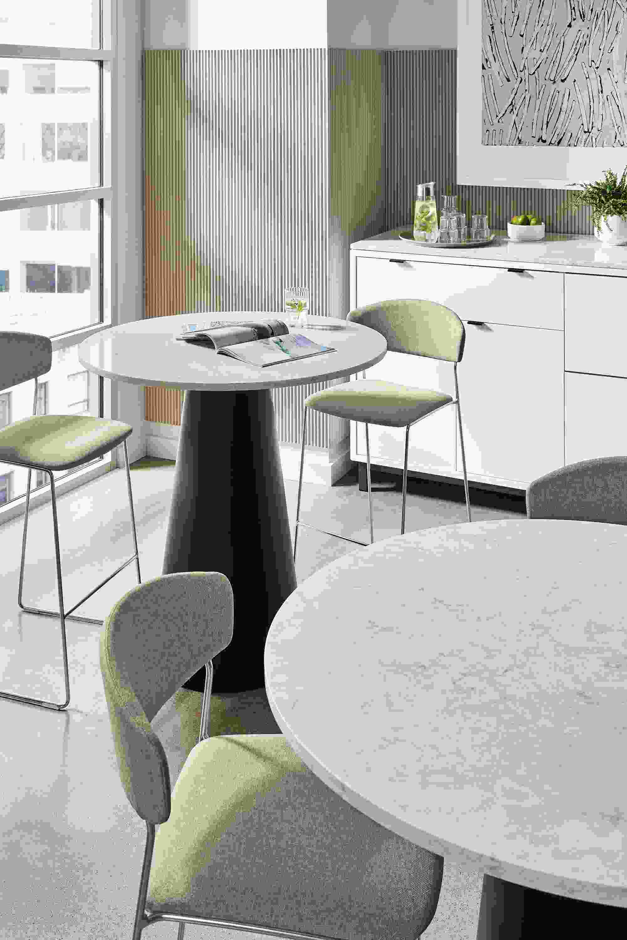two decker tables in office dining space with wolfgang chairs.