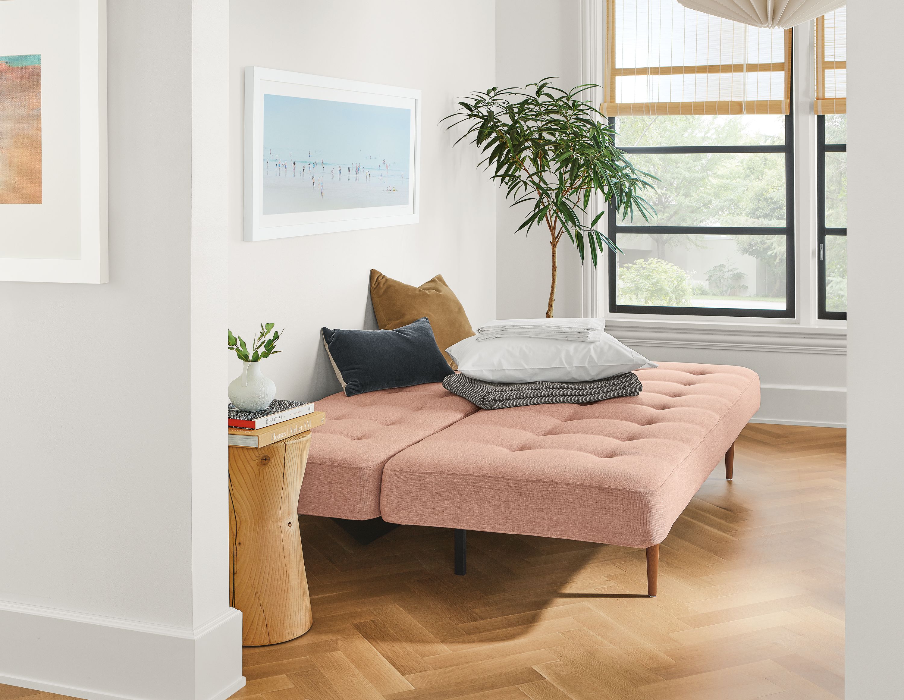 Detail of Deco sleeper sofa in Thera Blush fabric in bed mode.