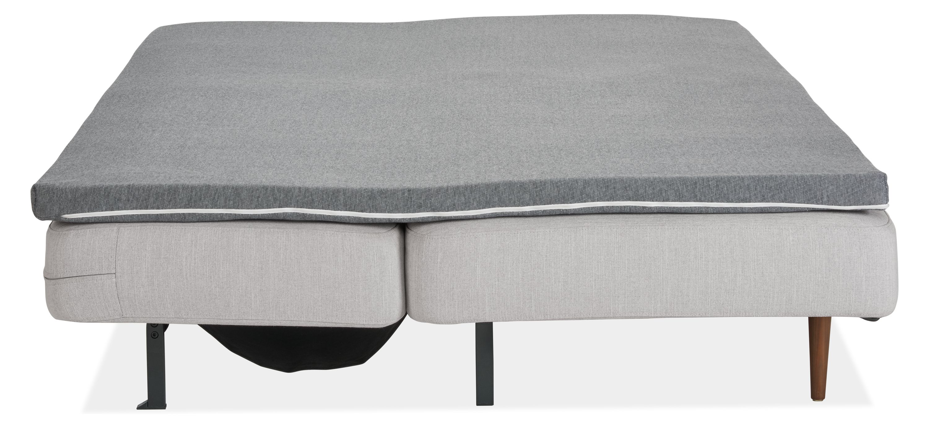 Deco armless sleeper sofa in loft.