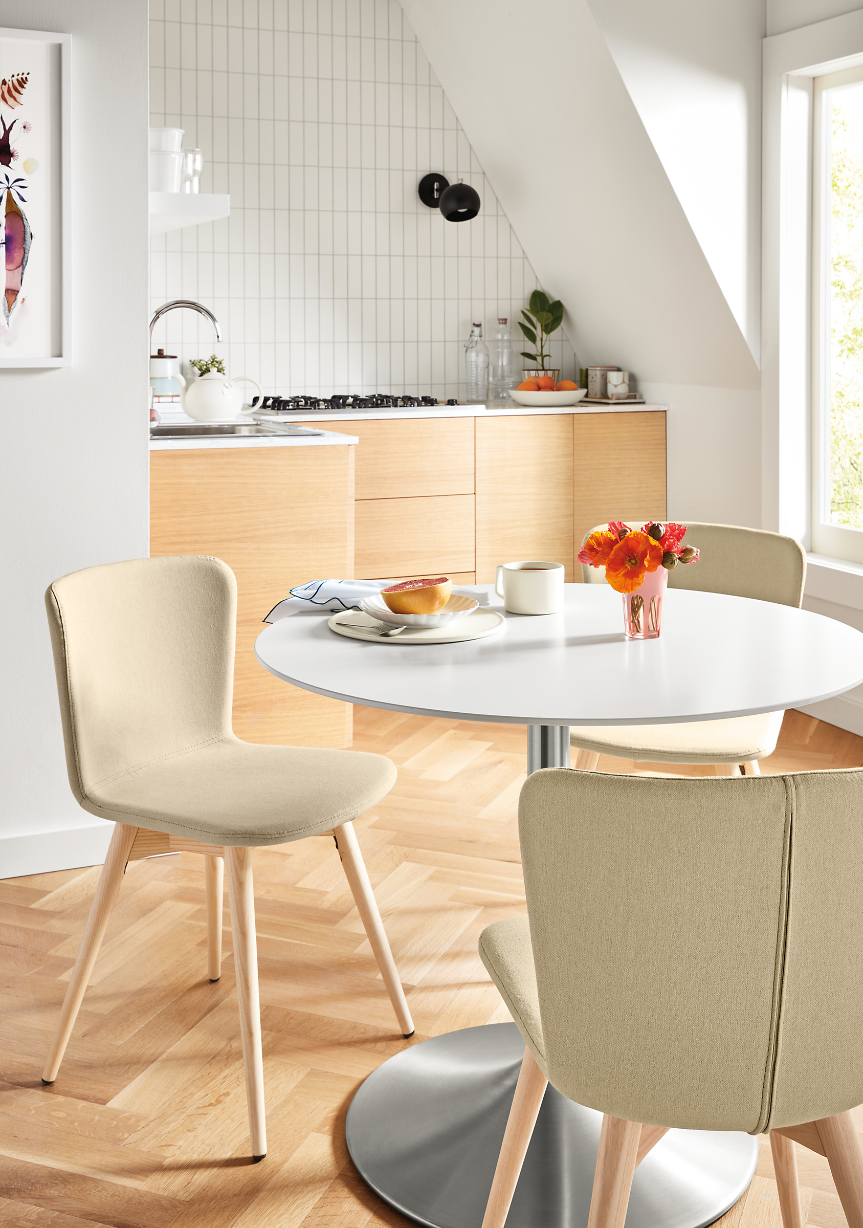 room setting with aria table and delilah chairs in fabric with wood legs in kitchen area