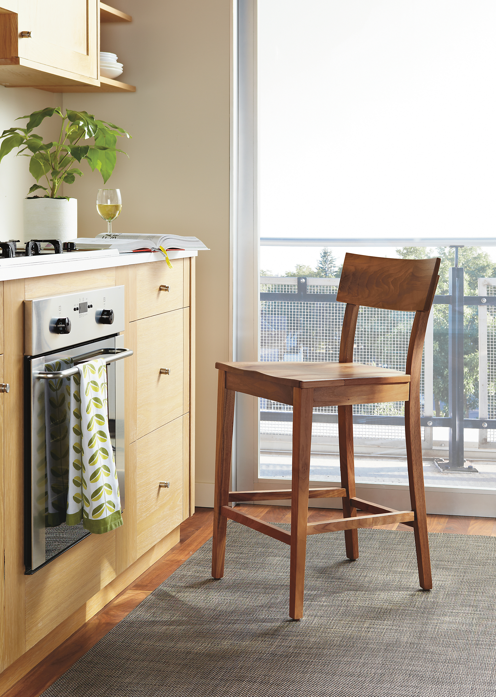 Kitchen in Doyle counter stool with wood seat in walnut.
