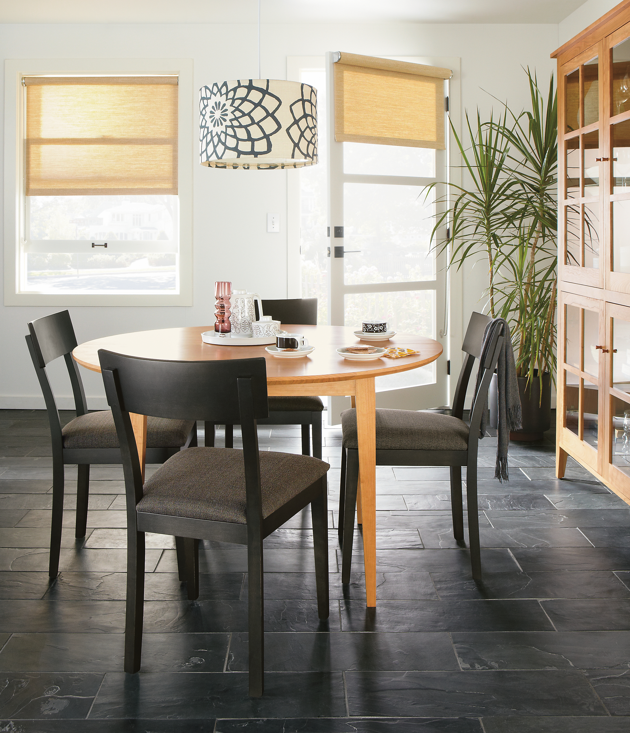 Dining room with Doyle side chair in maple with charcoal finish.