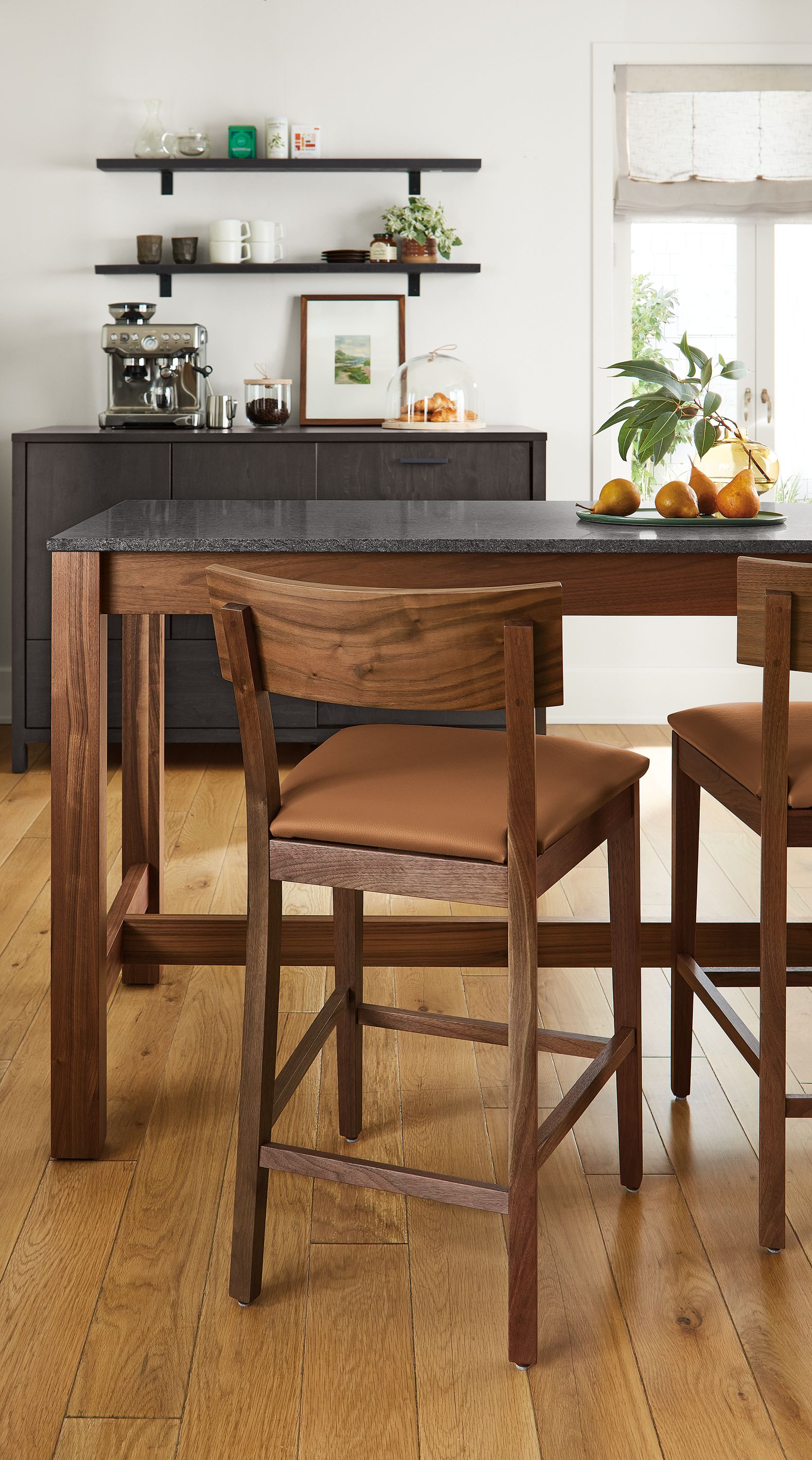Counter stool in Pesaro cognac leather with walnut frame