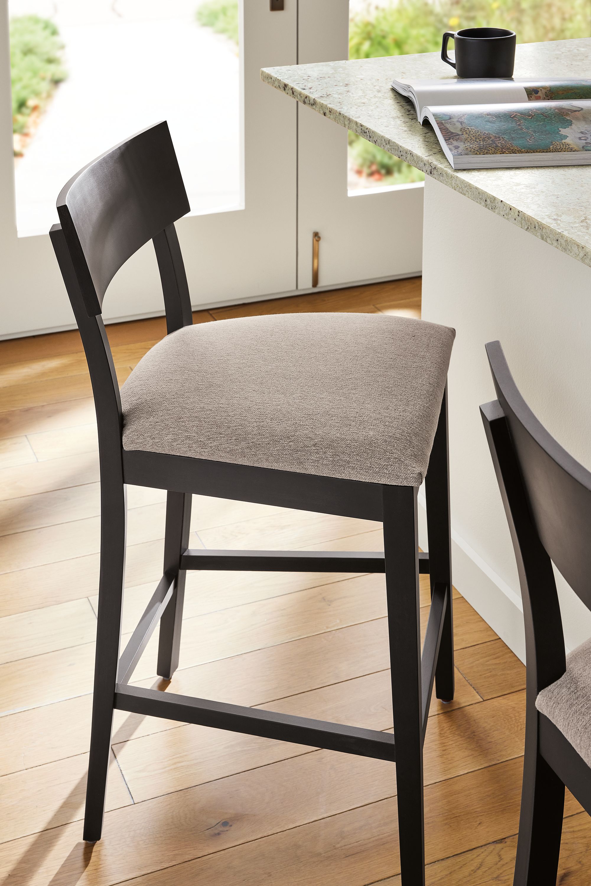 Counter stool in charcoal stain with Flint ivory fabric
