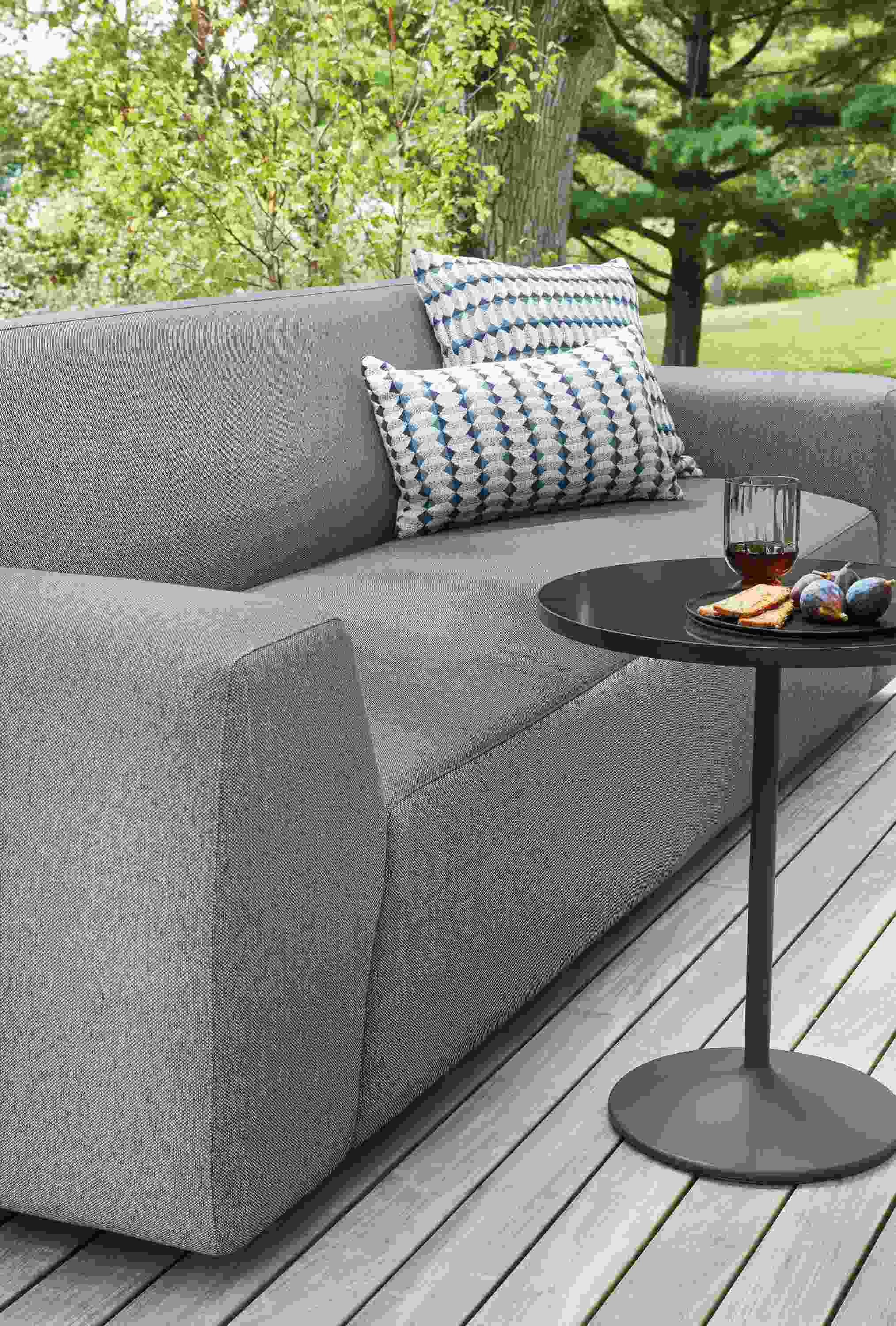 Outdoor space with Drift outdoor sofa and Aria outdoor side table.