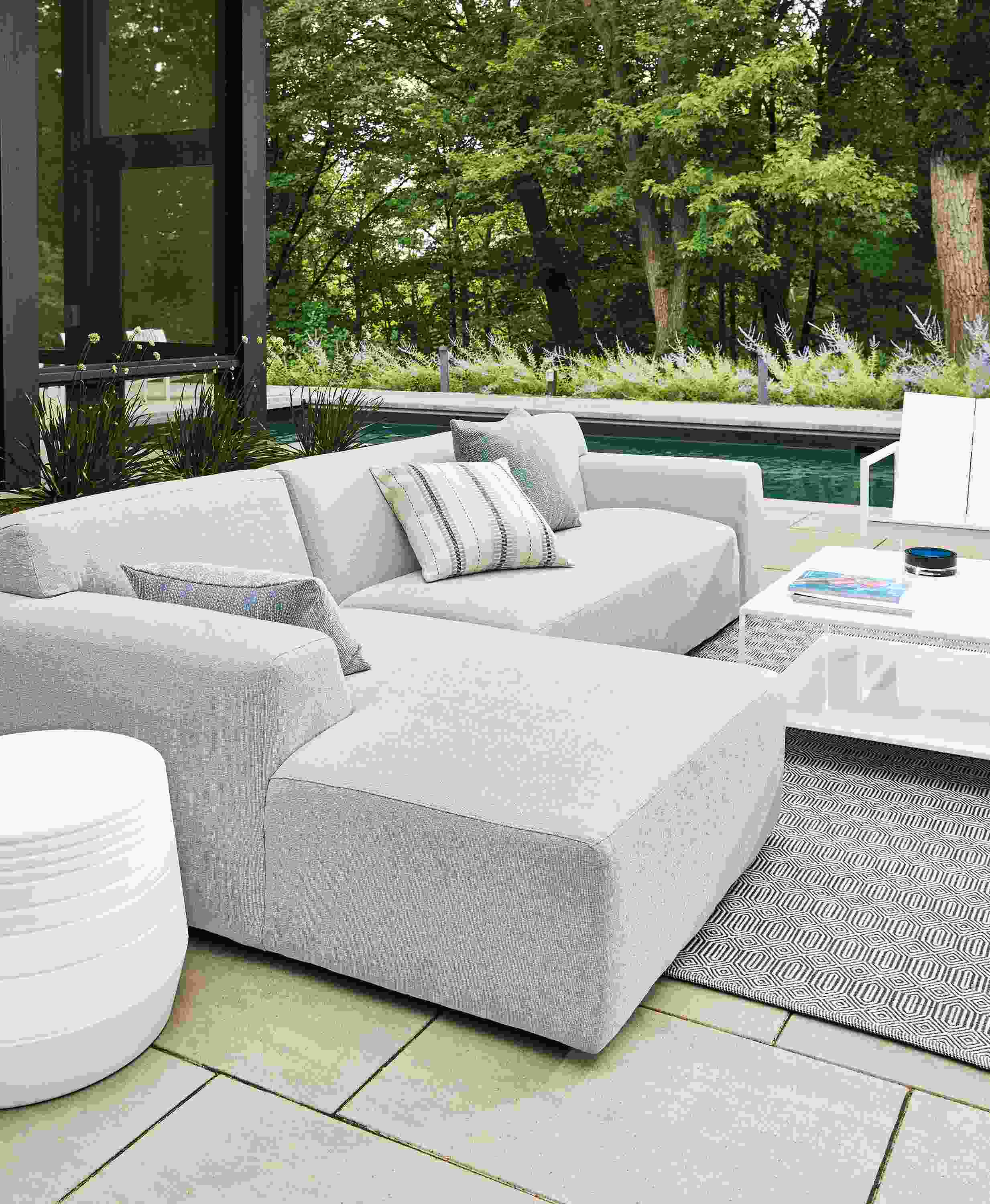 outdoor space with white drift sofa, cusp stool, circuit coffee table.