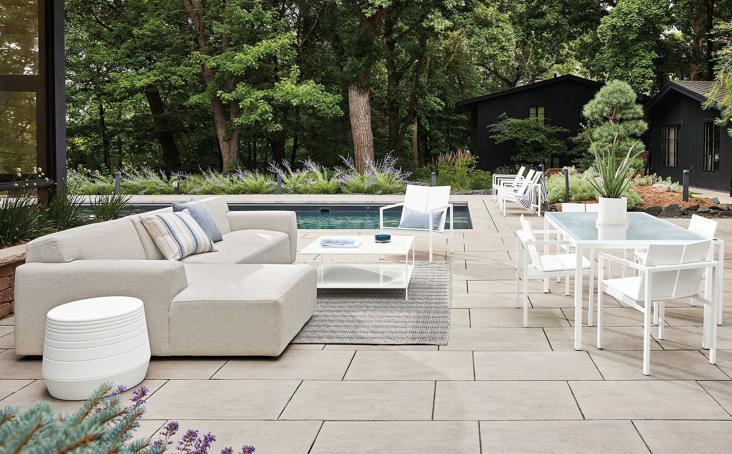 outdoor space with white drift sofa, mattix lounge and dining chairs, parsons dining table.