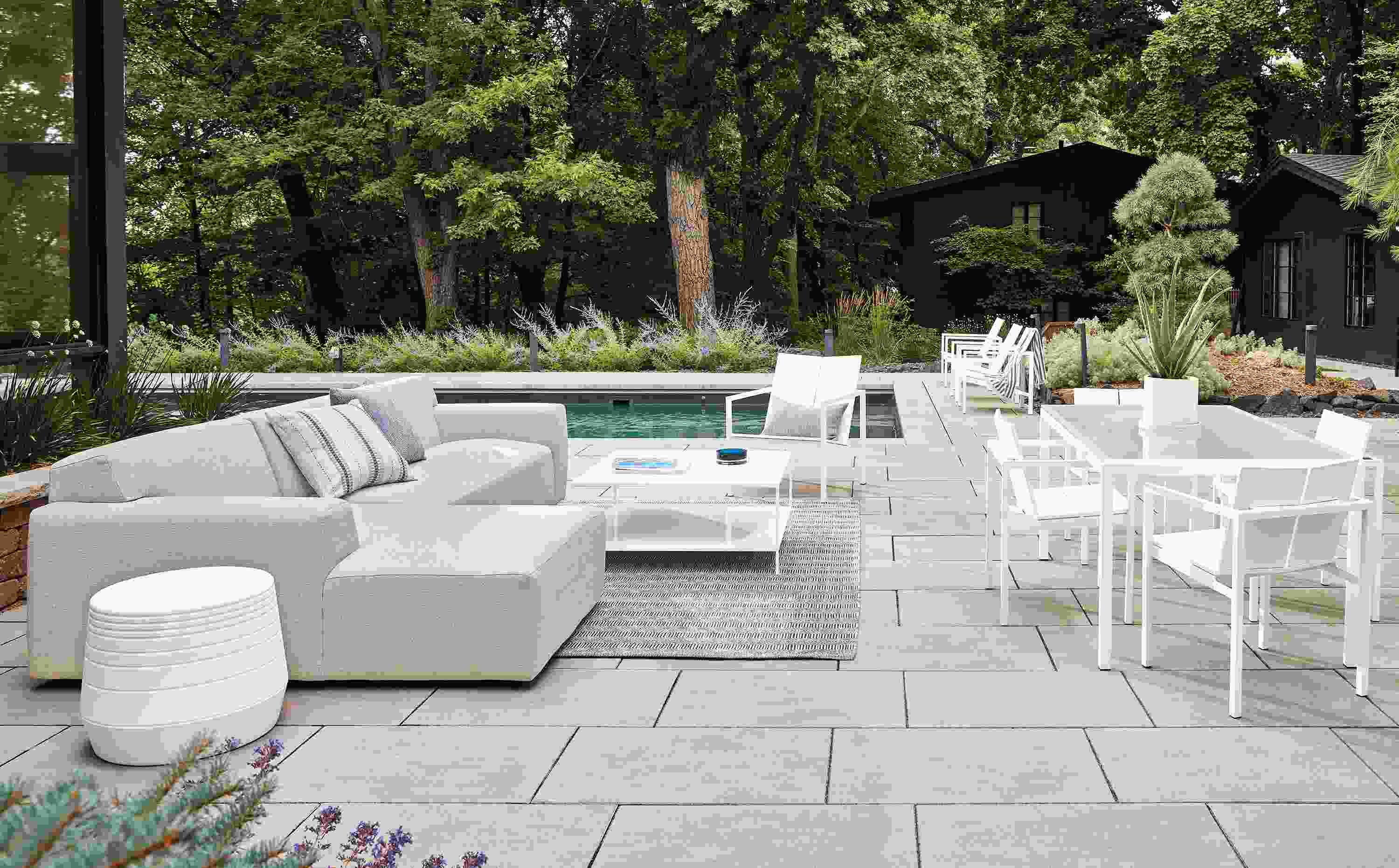 outdoor space with white drift sofa, mattix lounge and dining chairs, parsons dining table.