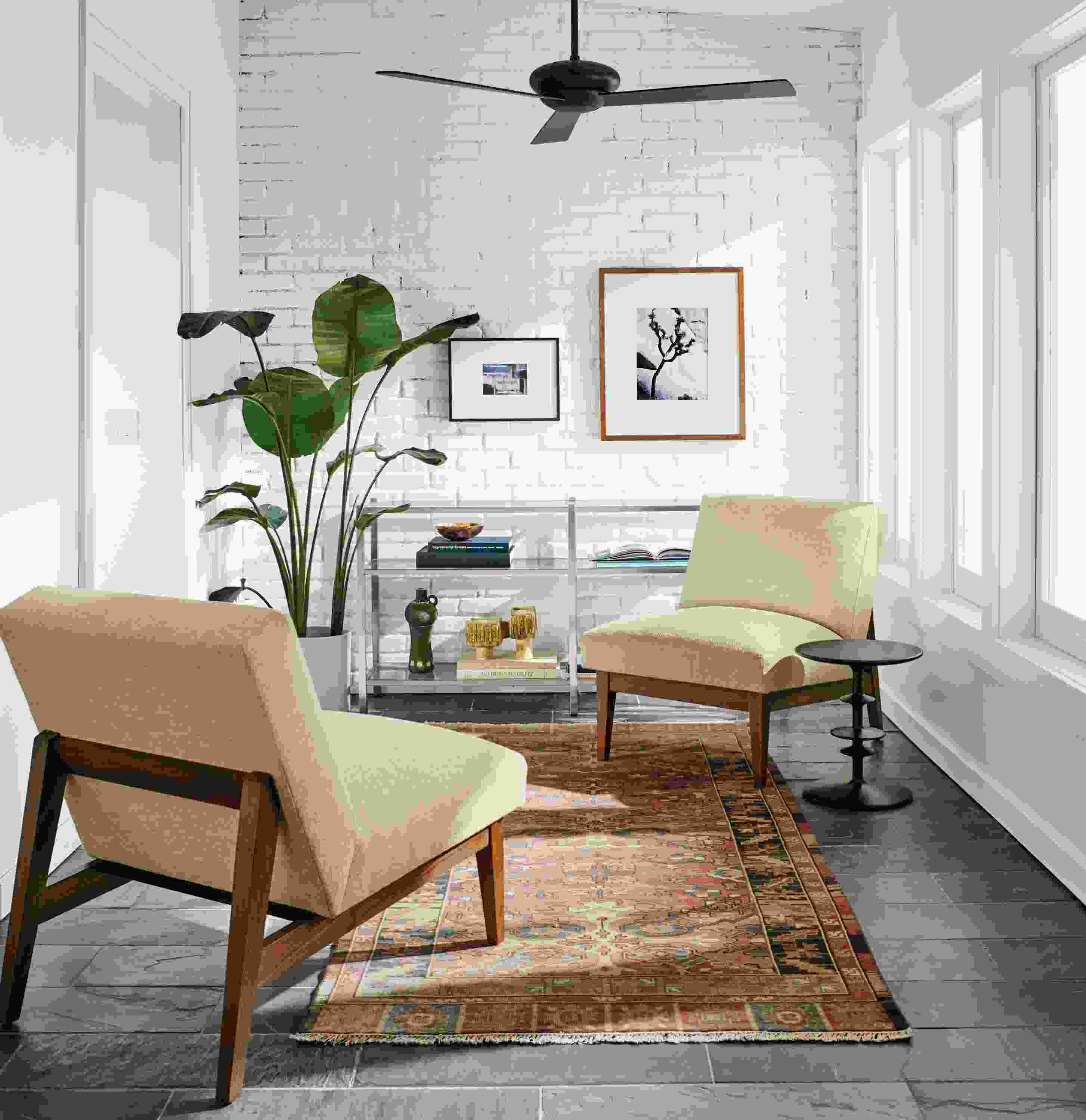 Detail of two Edwin accent chairs.